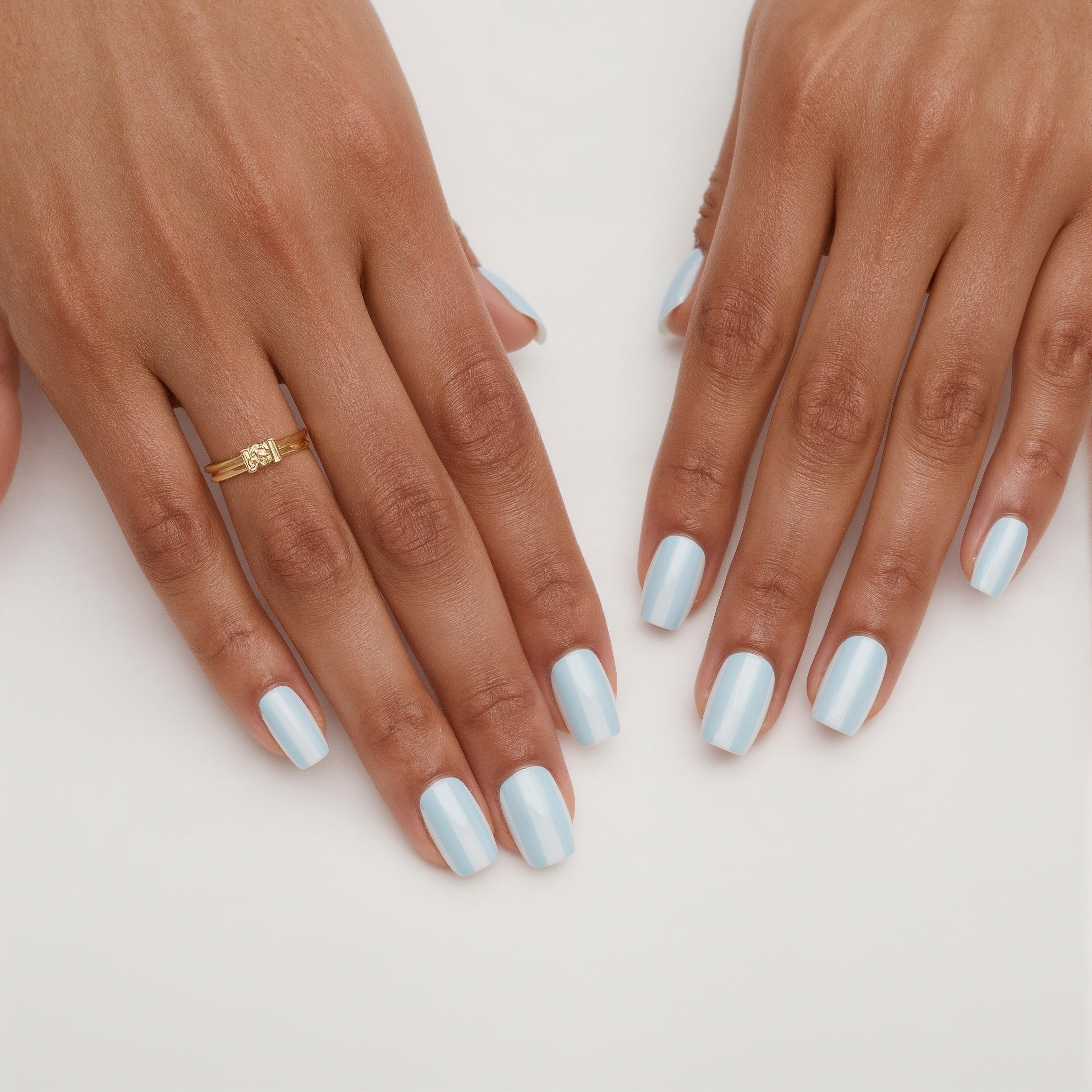 Soft blue stripes on matte nails