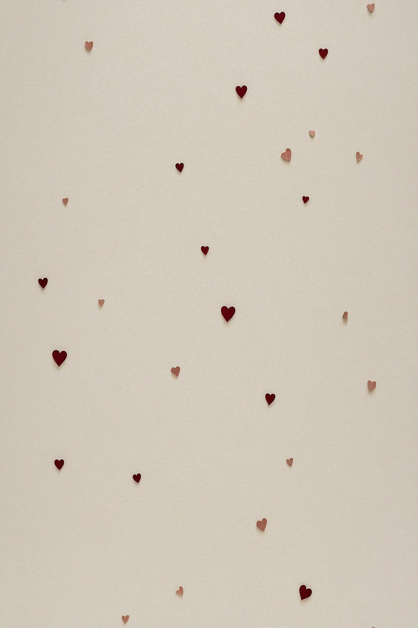 Scattered Hearts on a Textured Cream Background