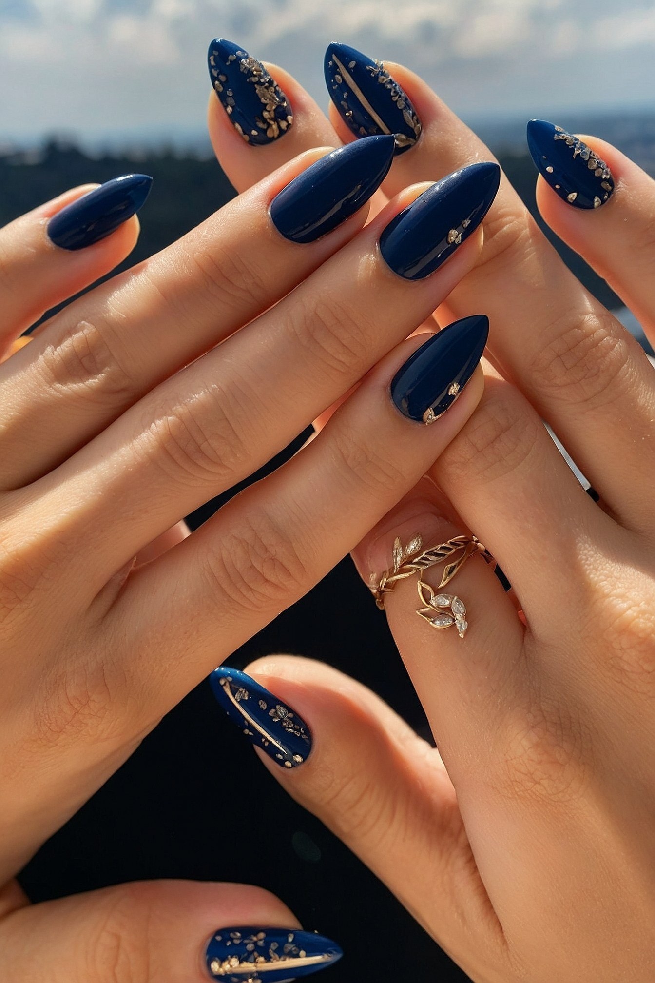 Deep Navy Almond Nails with Gold Embellishments