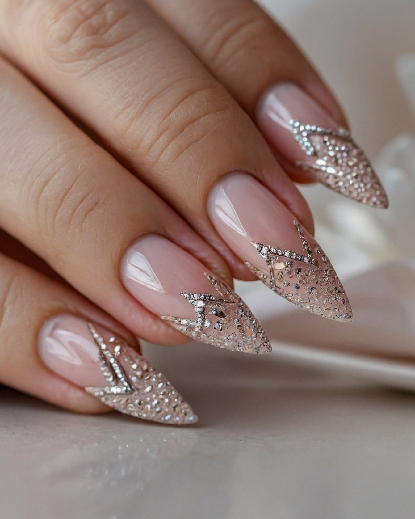 Sparkling crystal embellishments on stiletto nails