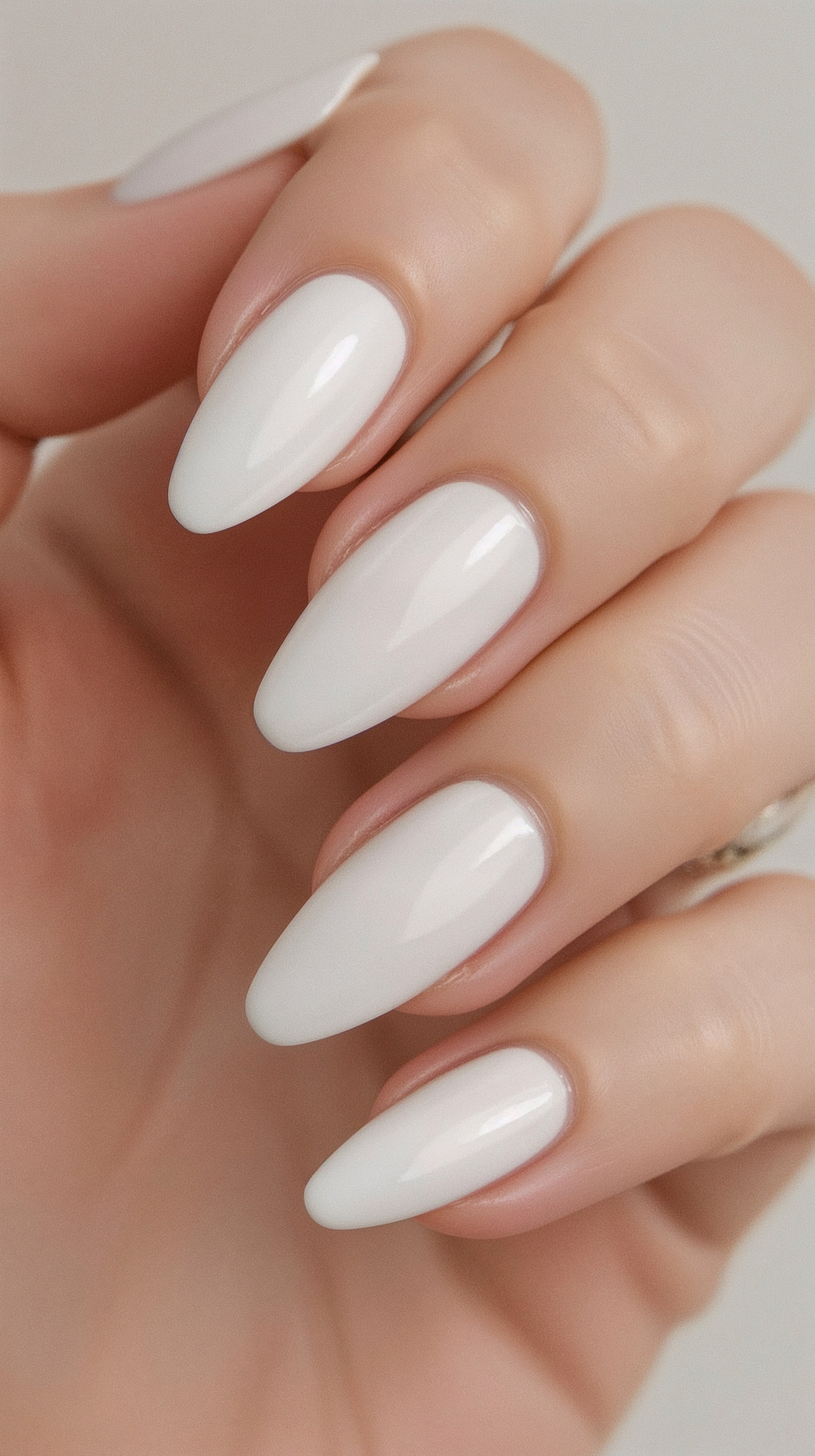 Almond-shaped nails with creamy white polish