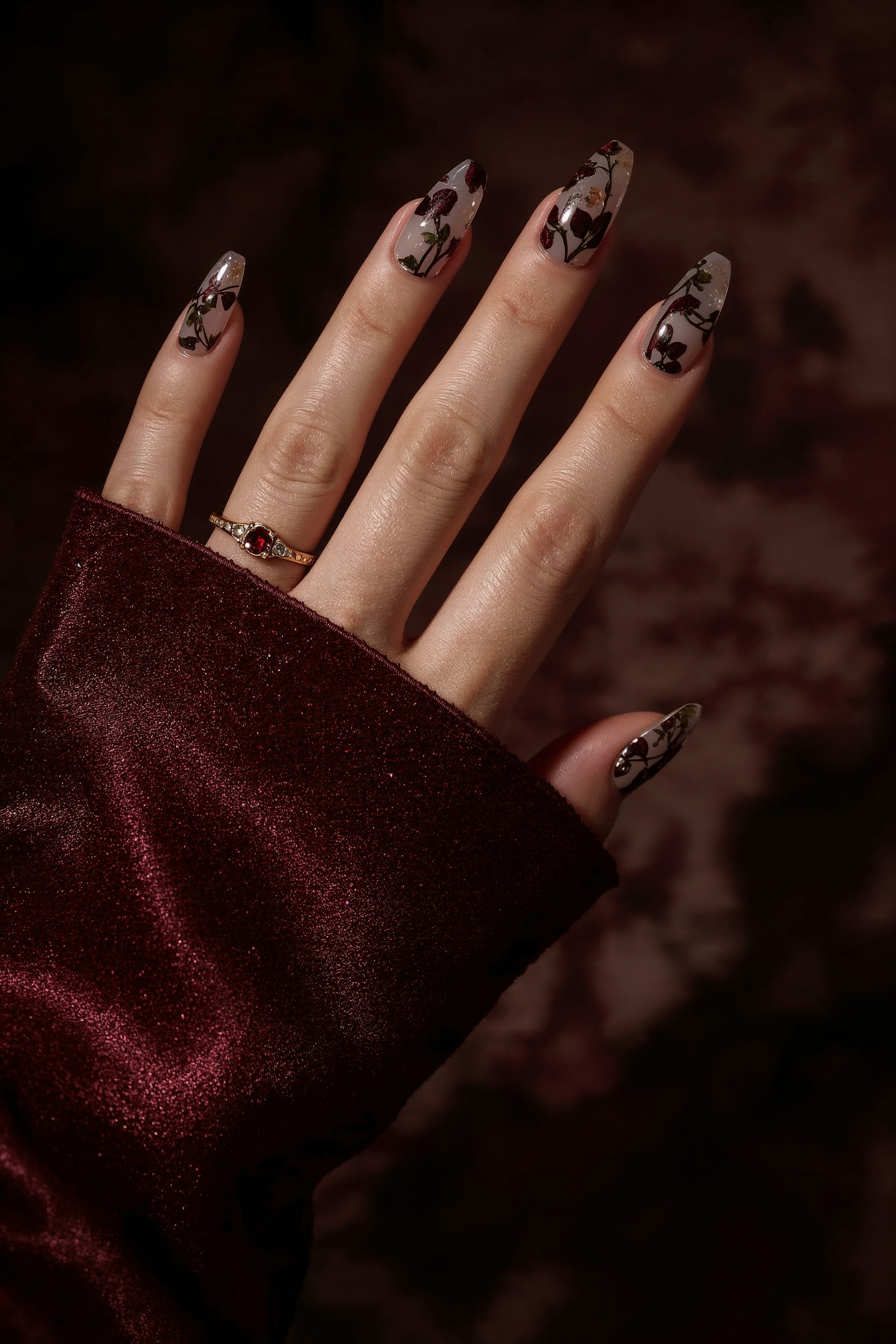 Translucent Nails with Dark Floral Motifs