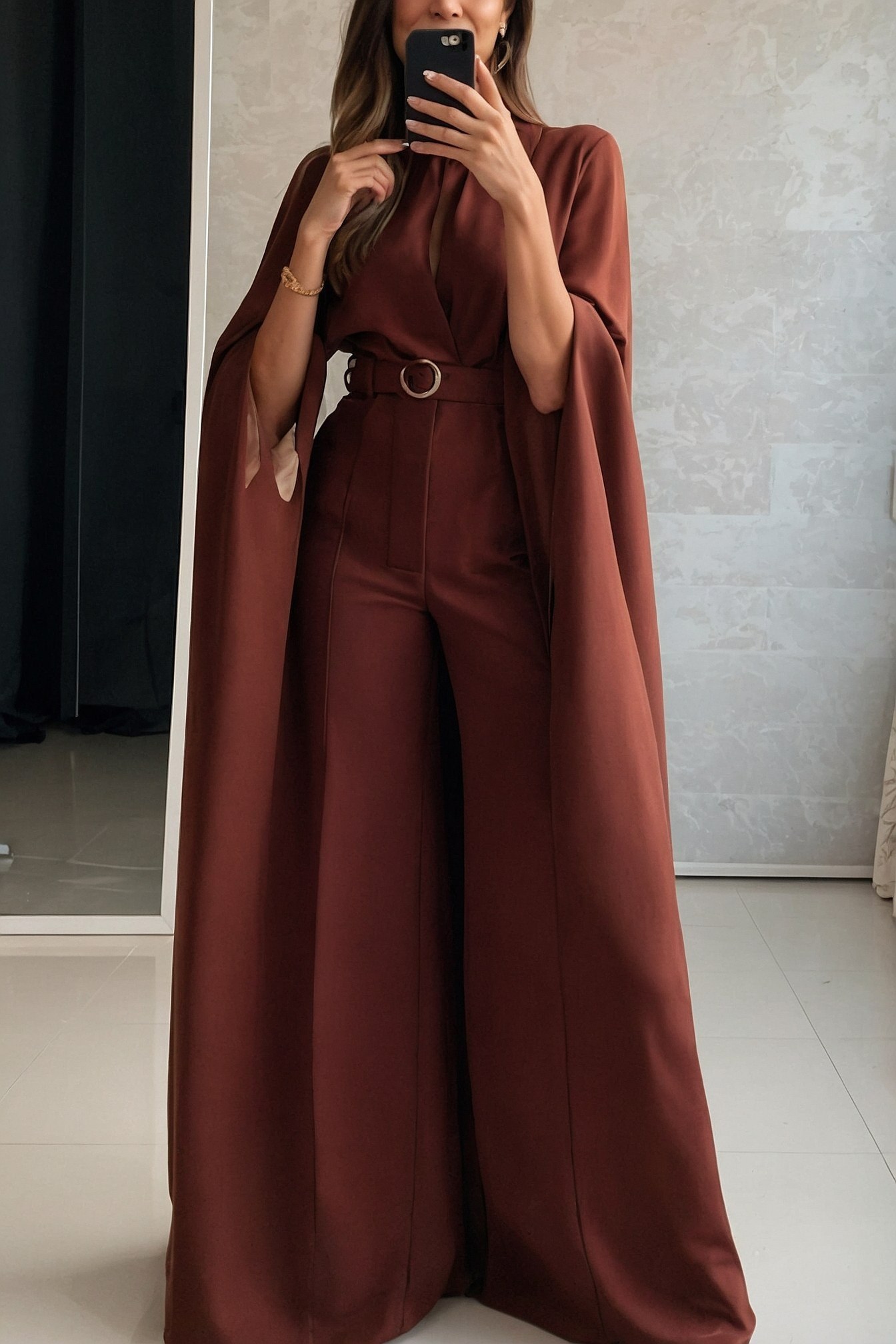 Flowing cape sleeves in deep maroon
