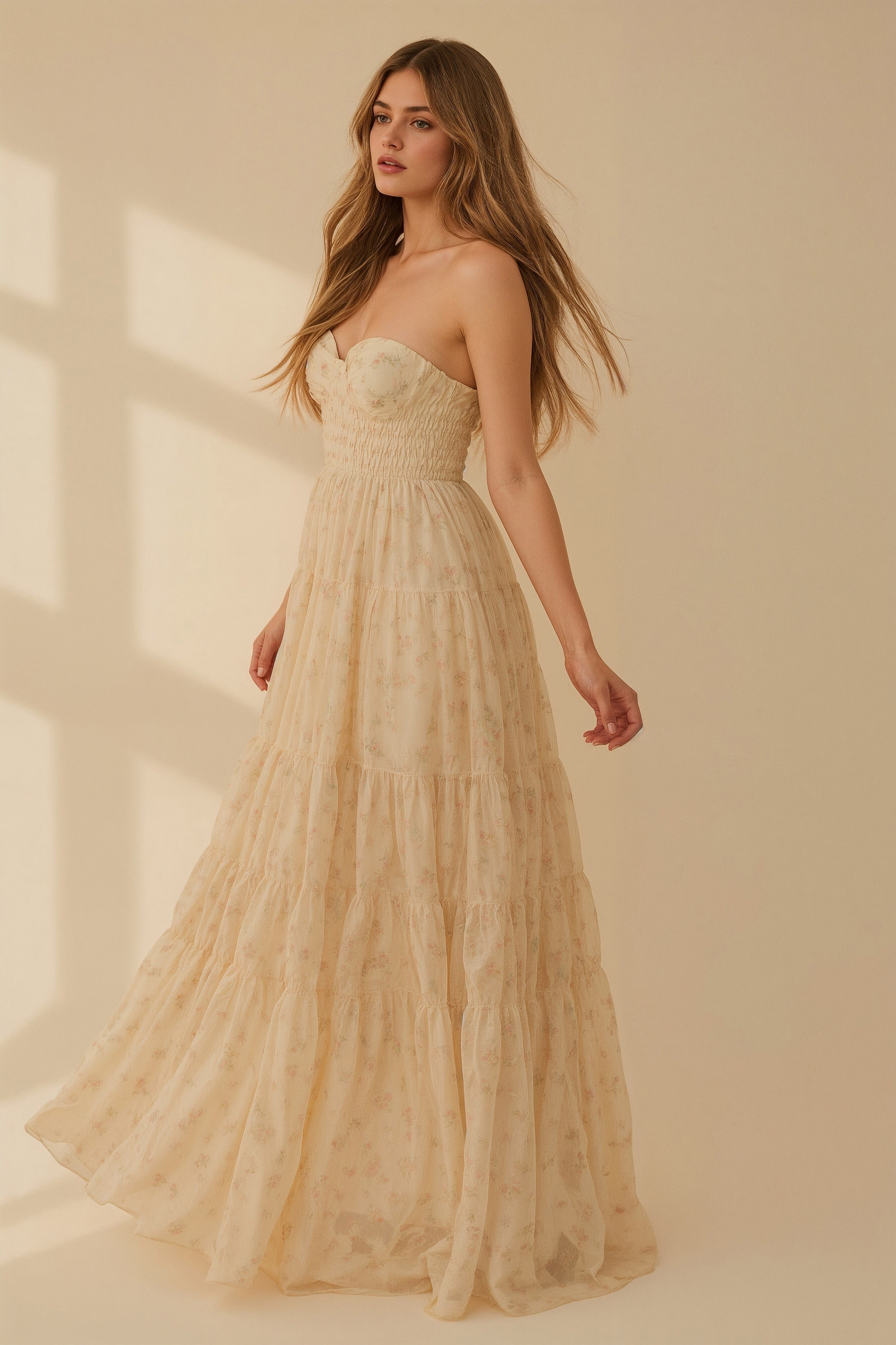 Sheer floral gown with smocked bodice and tiered skirt