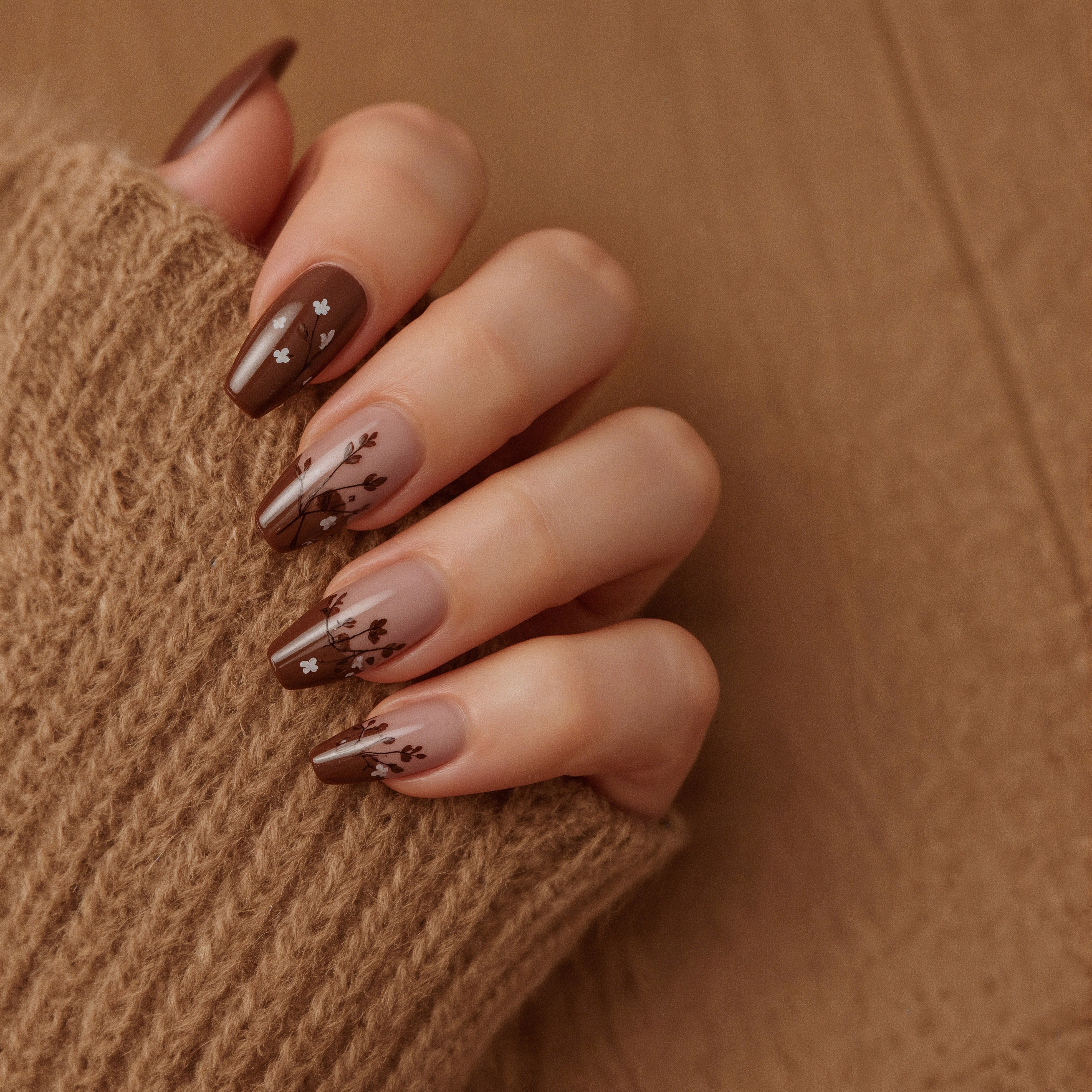 Cozy Knit Texture Meets Delicate Brown Floral Art