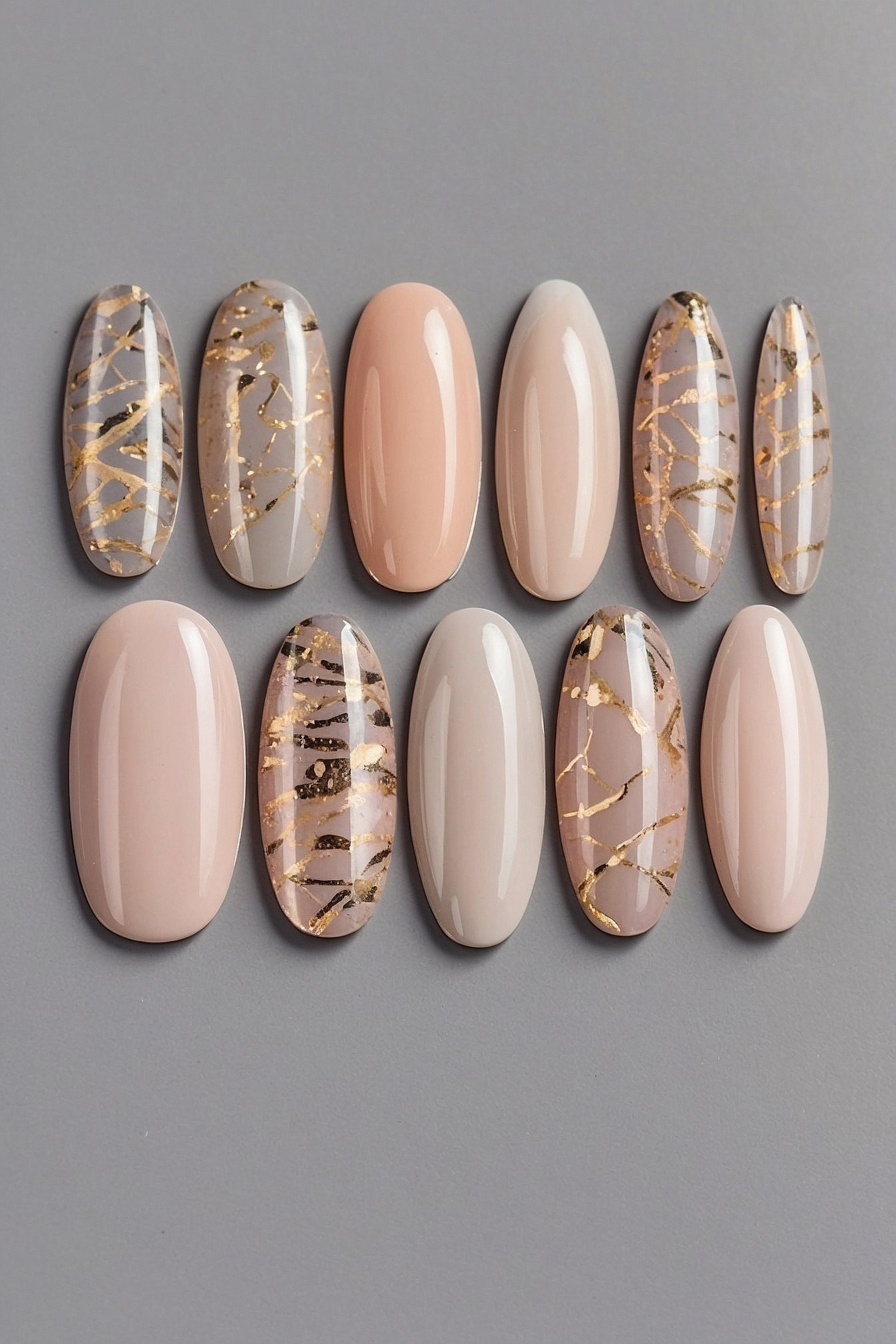 Nail Swatches With Neutral Tones and Gold Accents