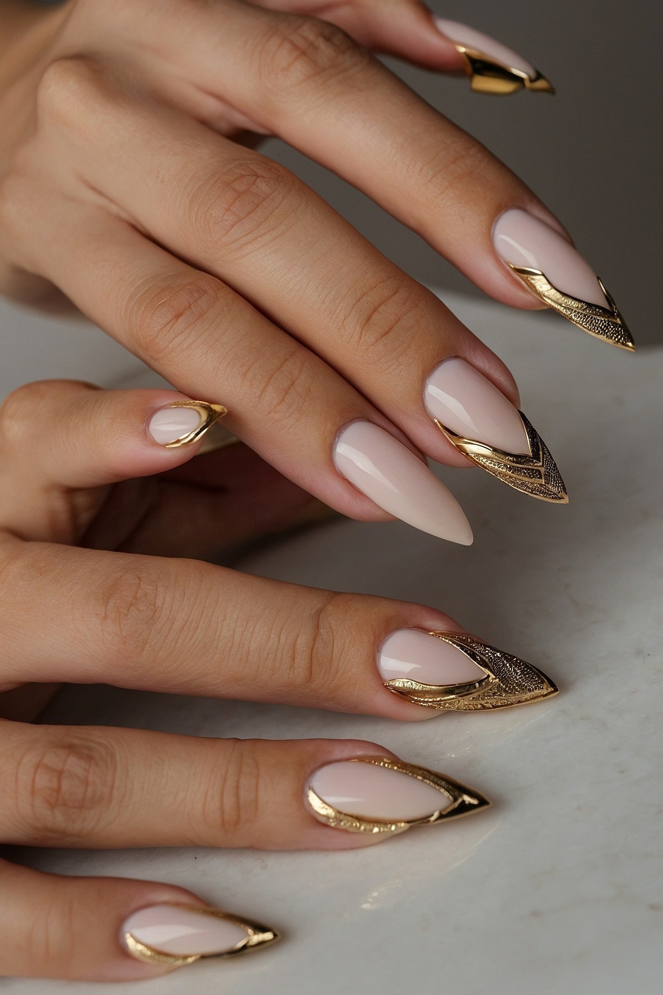 Sculpted Gold Tips on Almond Nails