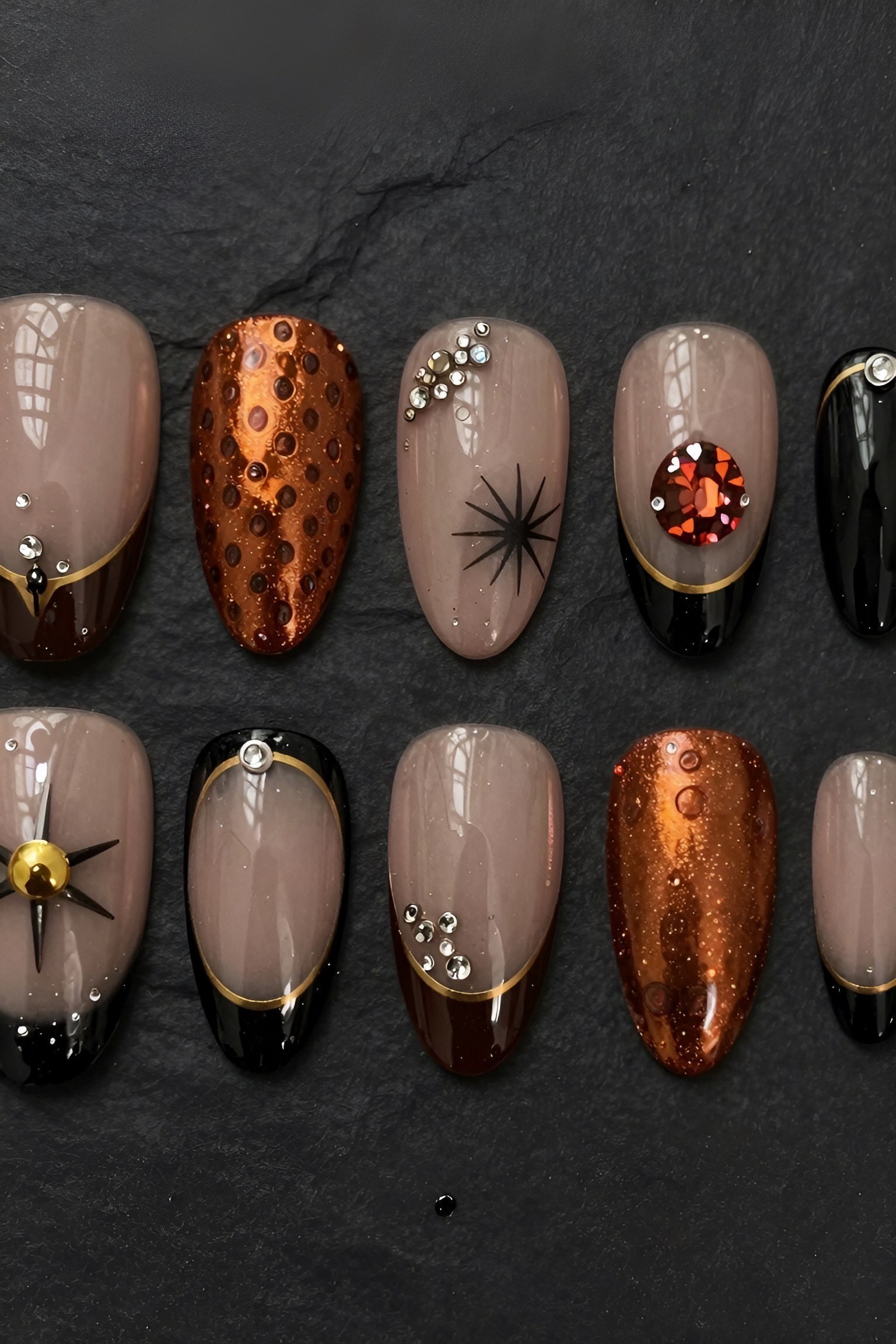 Chic Rhinestone and Star Accent Pumpkin Nails