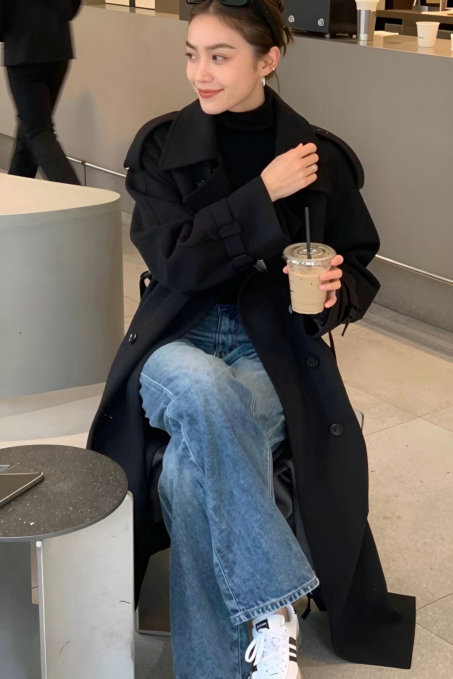 Pairing a Structured Dark Coat With Casual Denim Jeans