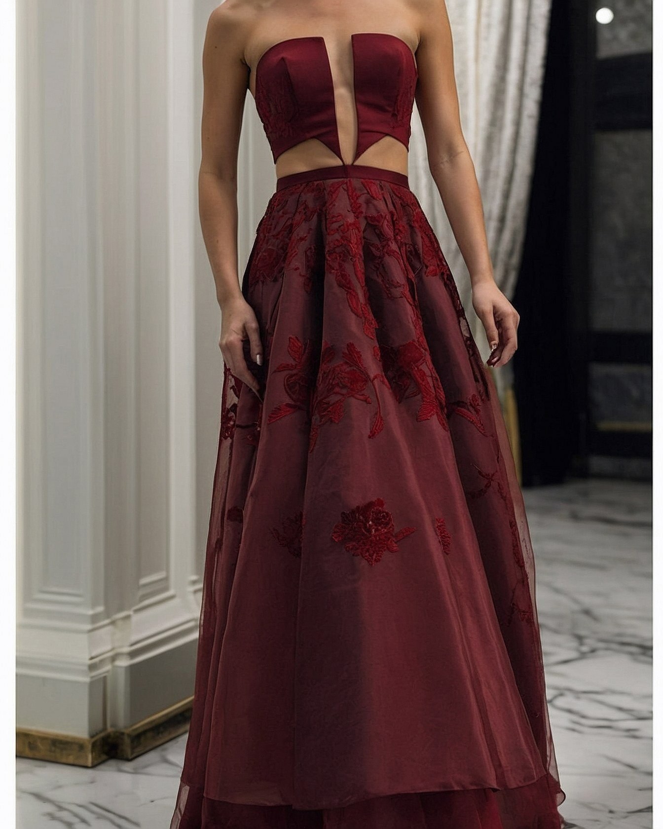 What's with the plunging neckline and cutouts?