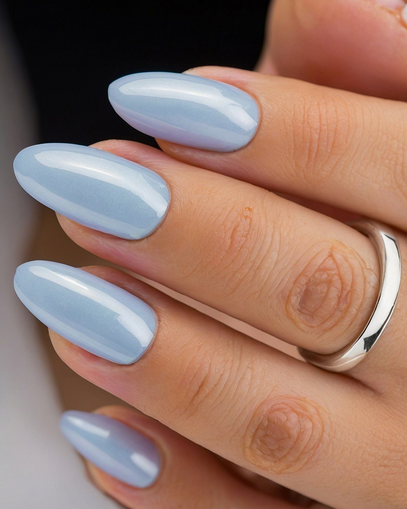 Close Up on Oval Nails with Subtle Blue Shimmer
