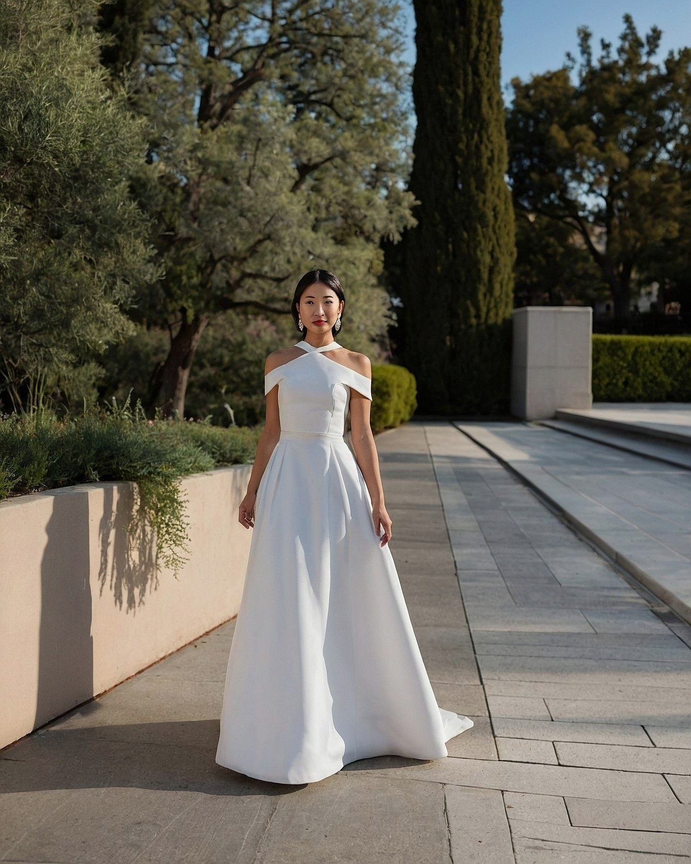 Geometric neckline on a flowing white gown