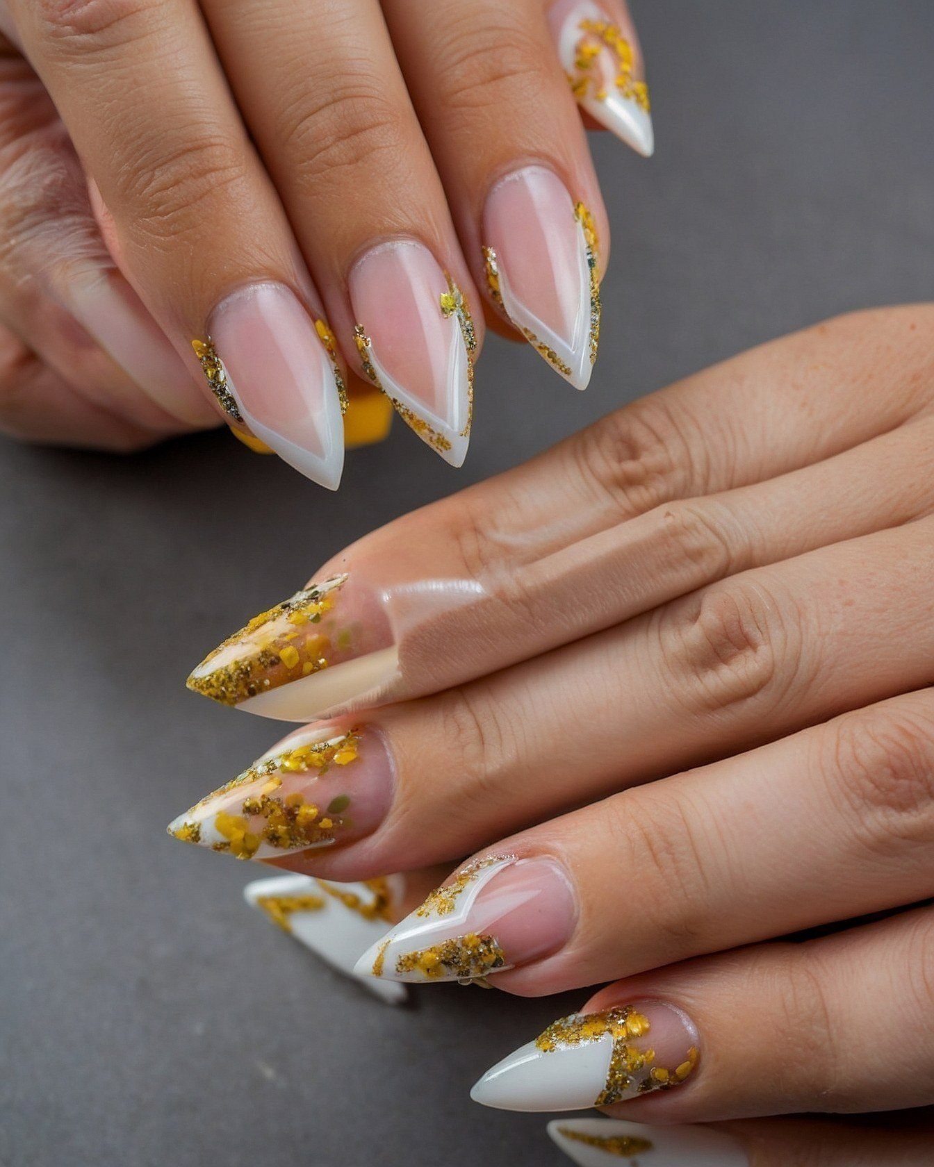 Sharp Stiletto Nails with Gold Leaf Accents