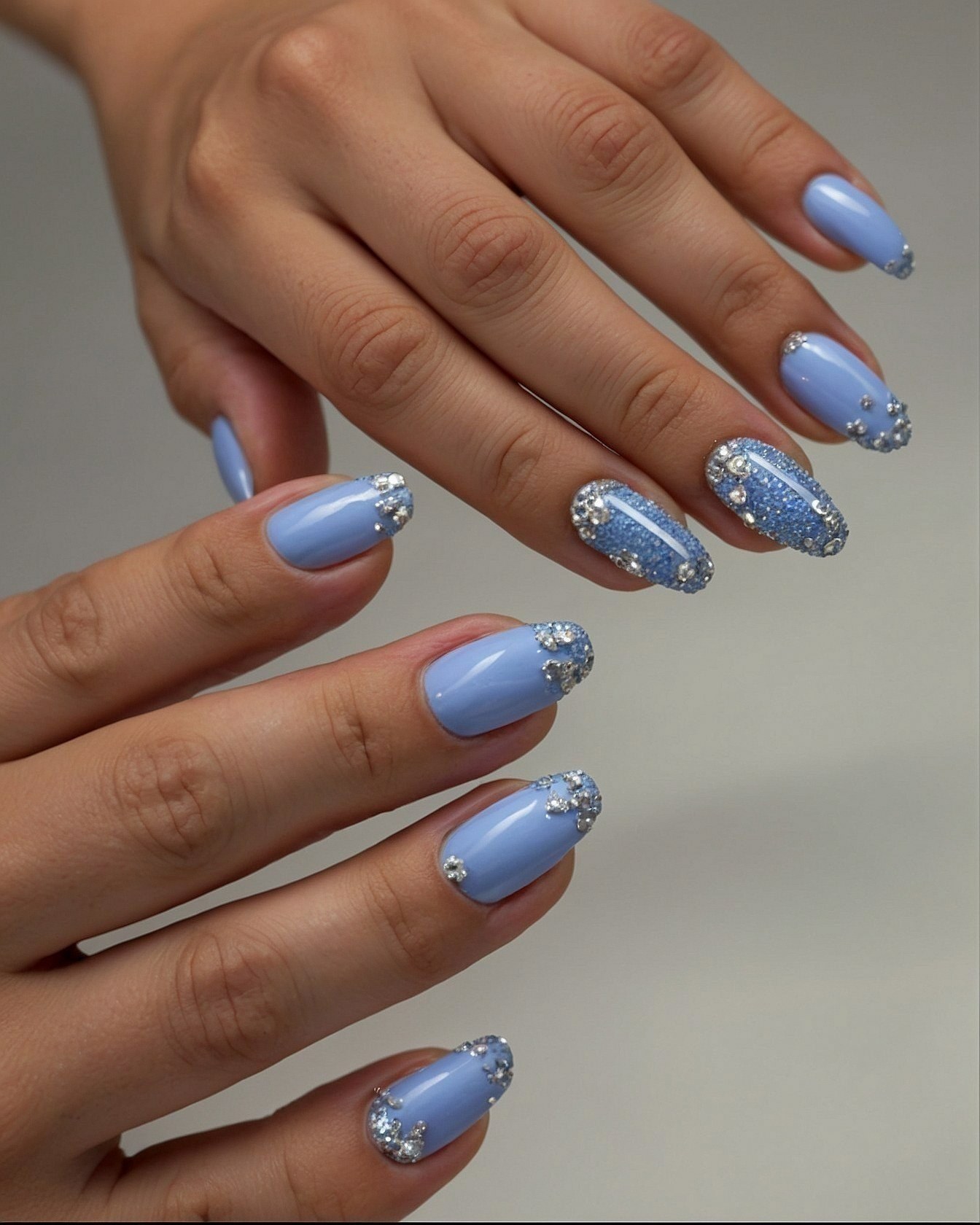 Subtle Sparkle on Pale Blue Almond Nails