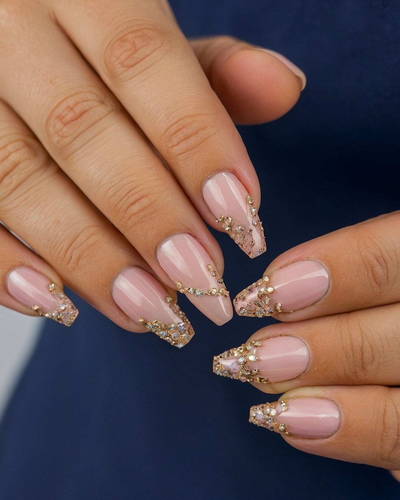 Close-Up of Coffin Nails Adorned with Gold and Crystals