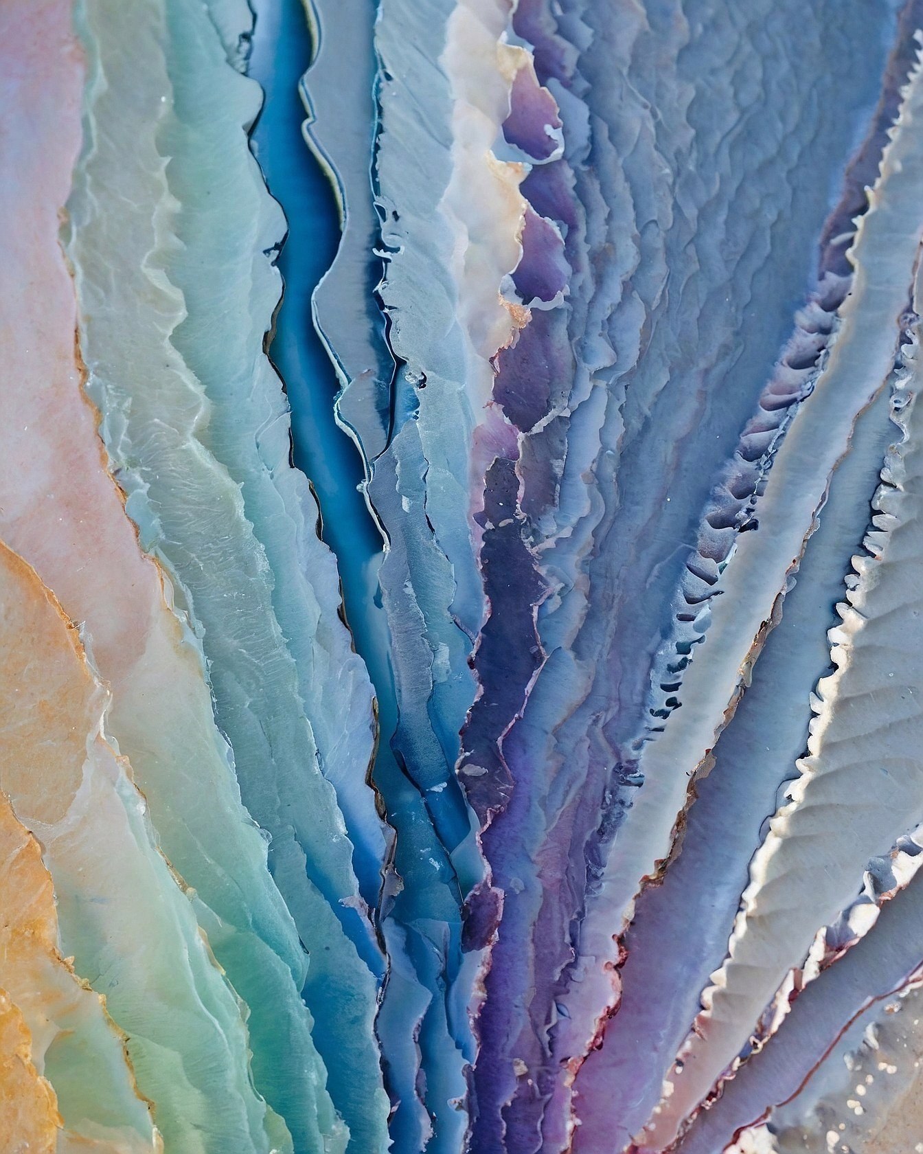 Striking geological layers in cool, calming tones