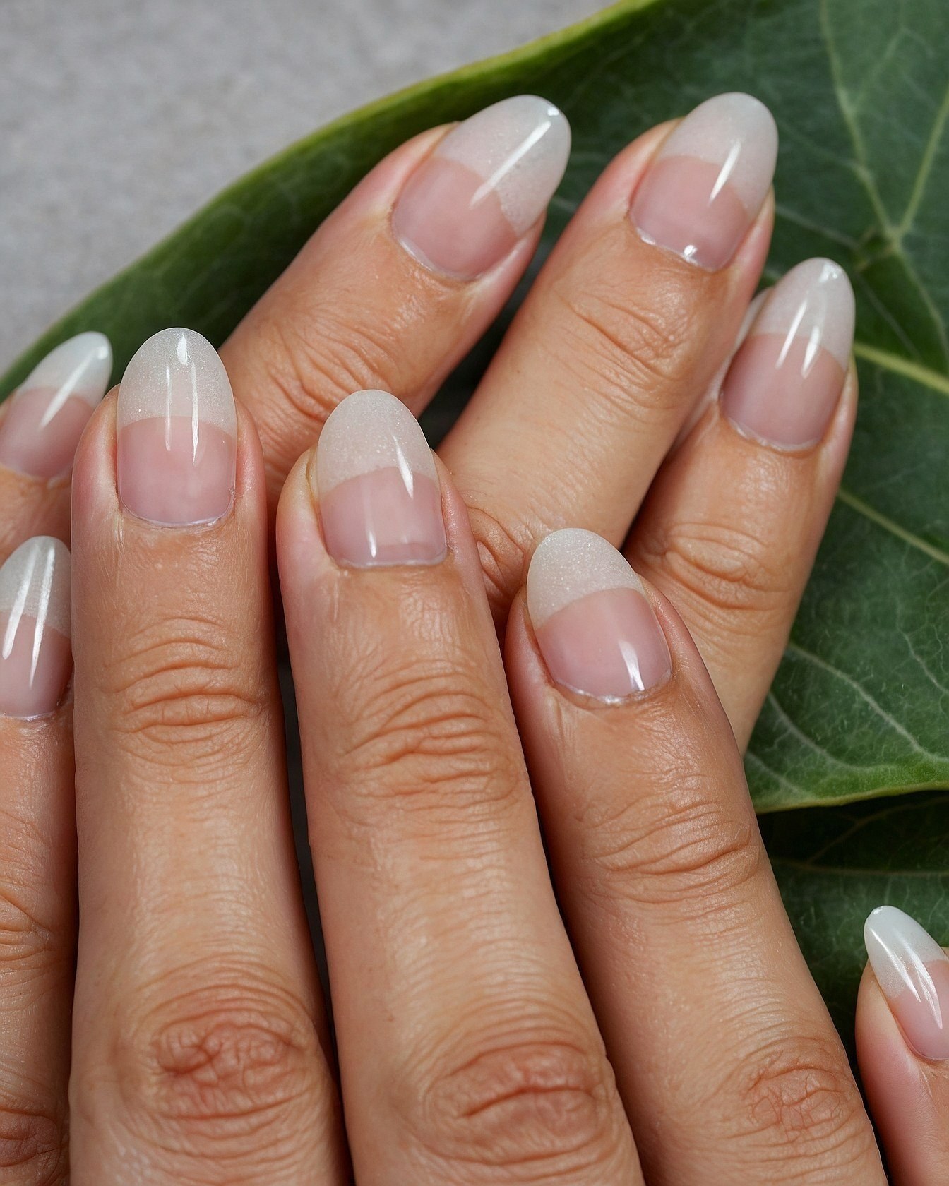 French Manicure with a Touch of Gold Leaf Accent