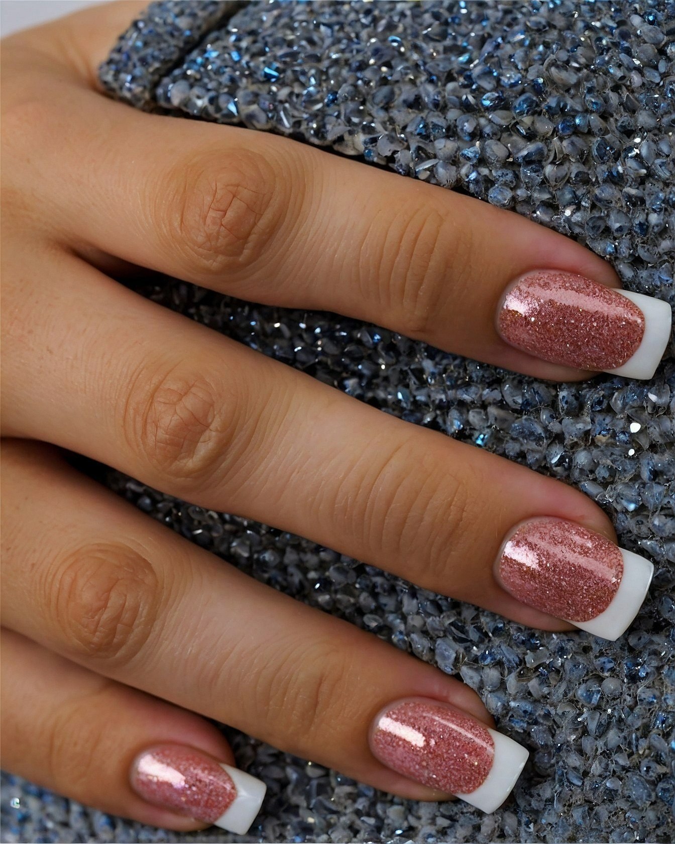 Close-up on Rose Gold Glitter French Tip Almond Nails