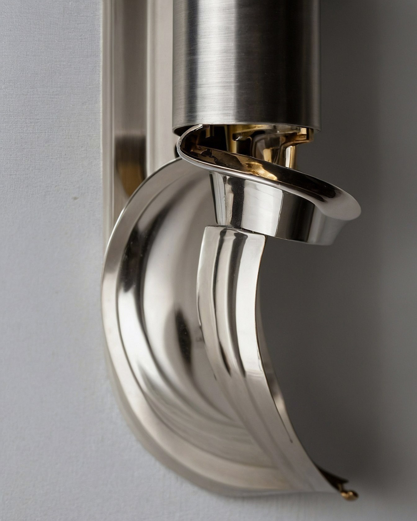 Sculptural Metal Details on a Textured Wall