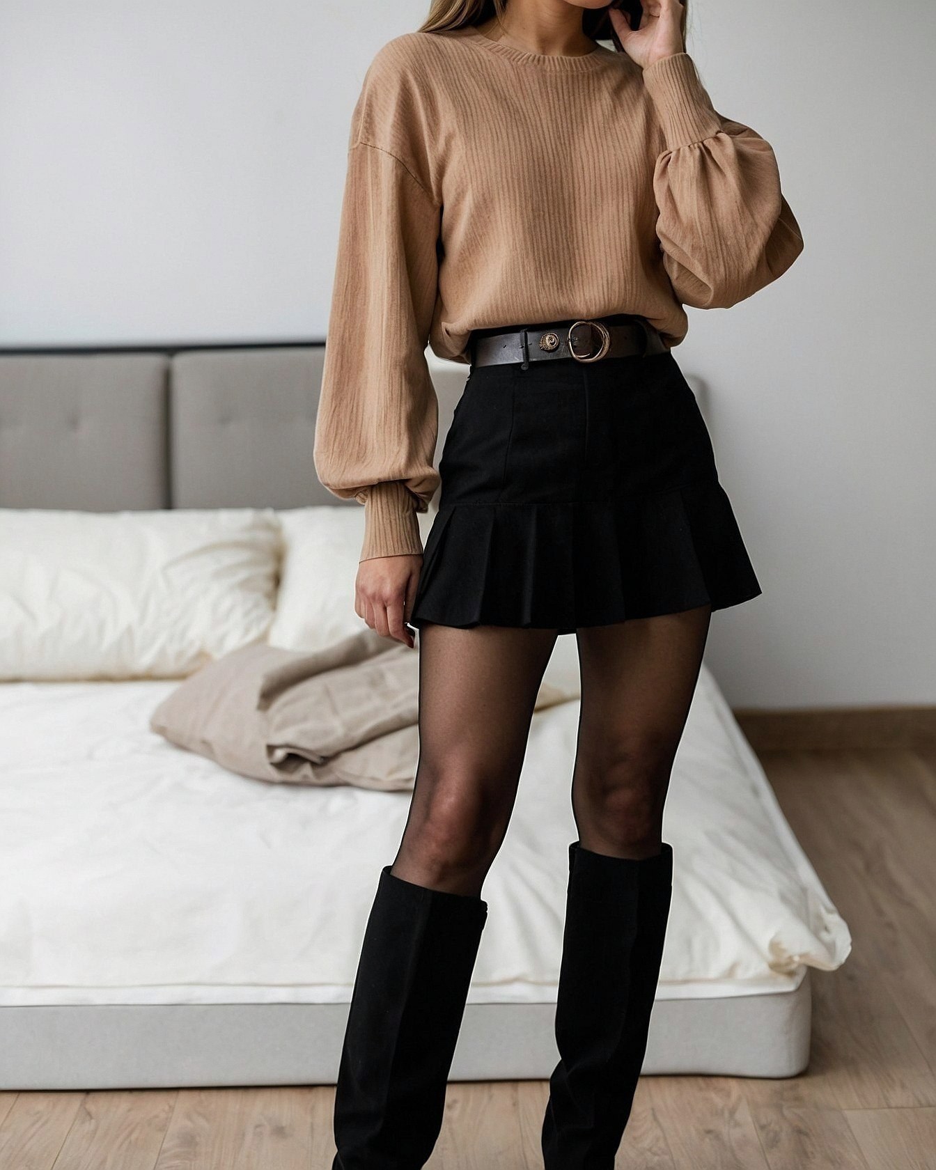 How does a ribbed knit sweater transform a mini skirt?