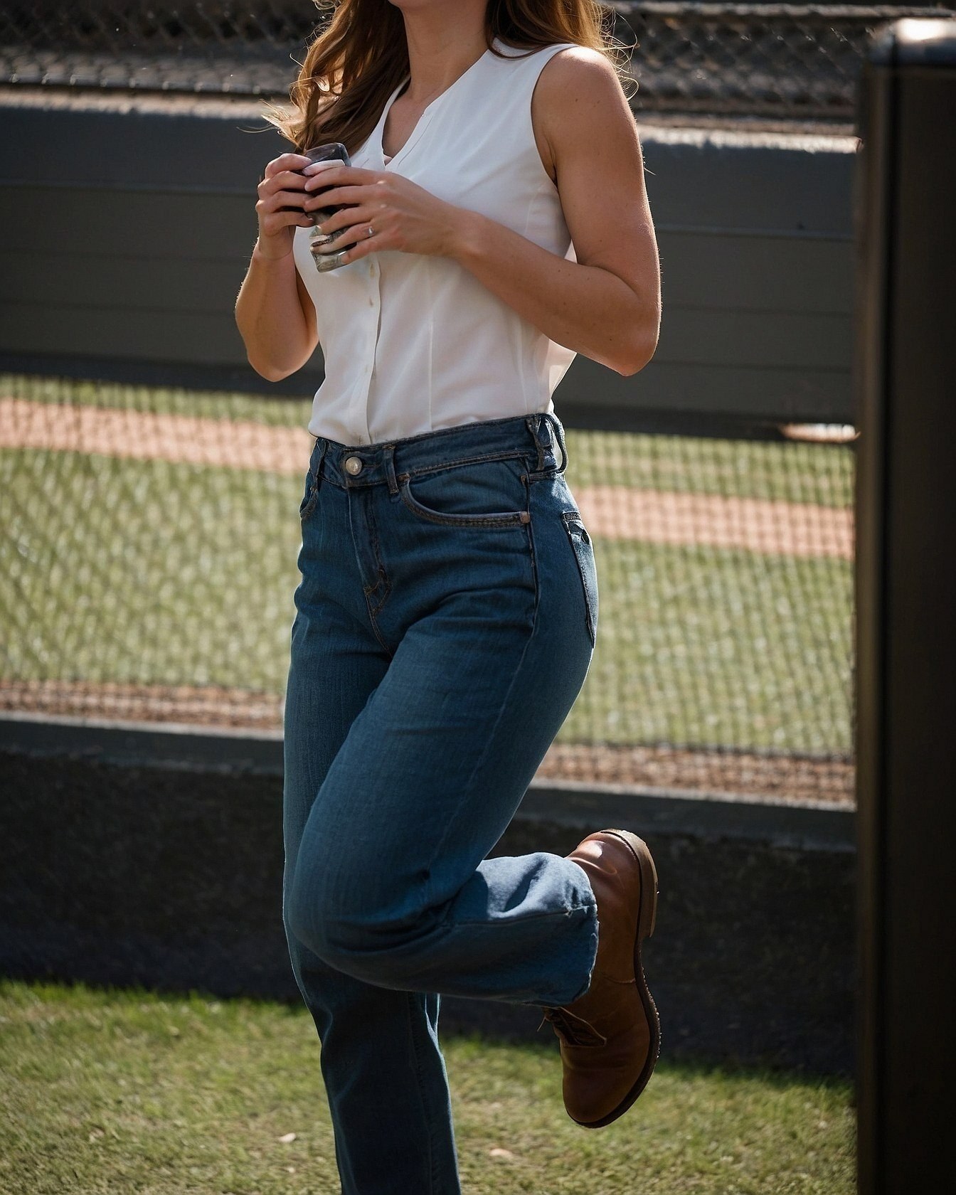 Casual Chic: A Sleeveless Top Meets Classic Denim