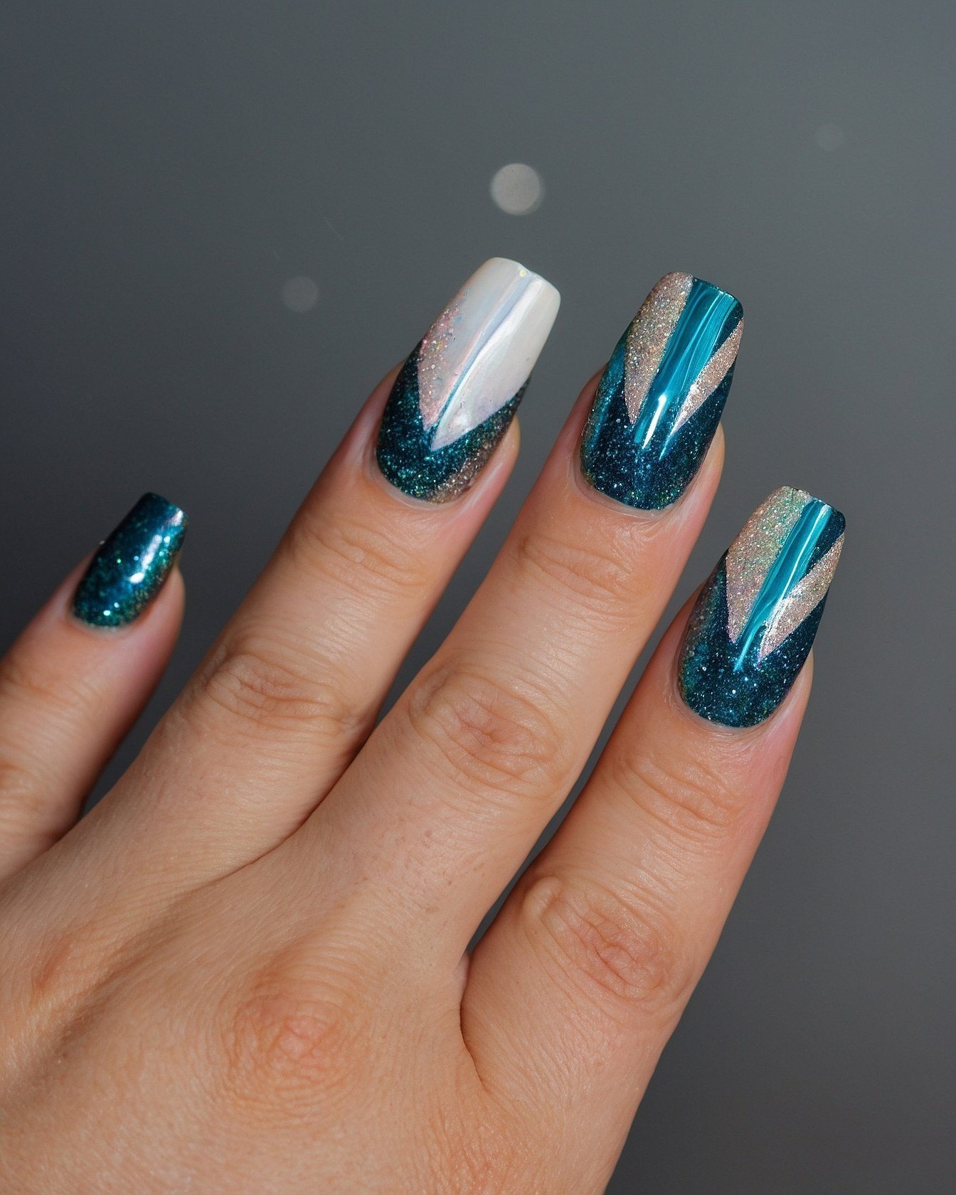 Geometric Teal and Silver Nail Art Close-Up