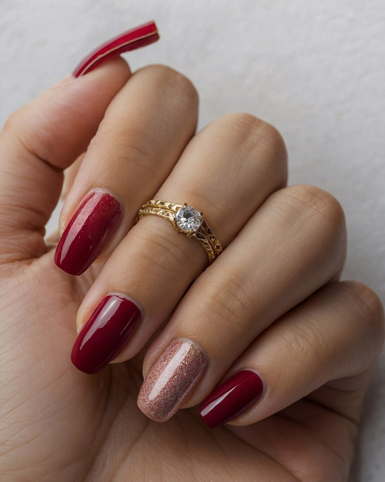 Deep Red Nails with a Rose Gold Accent