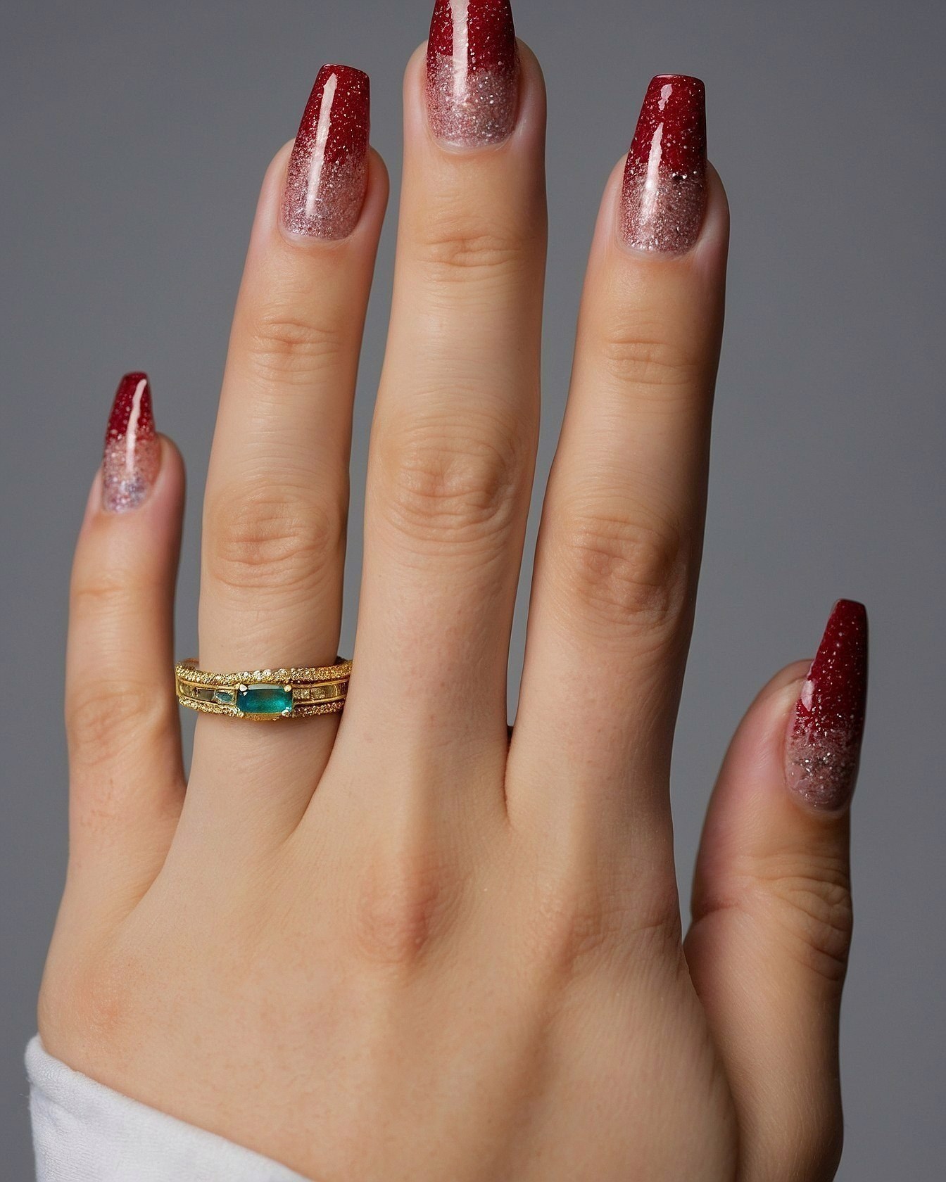 Glitter Gradient Stiletto Nails With Emerald Ring