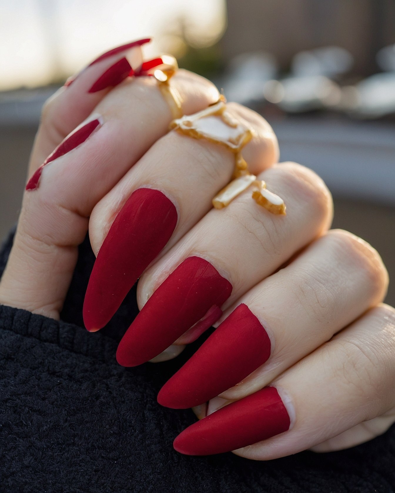 What makes these matte red stilettos so striking?