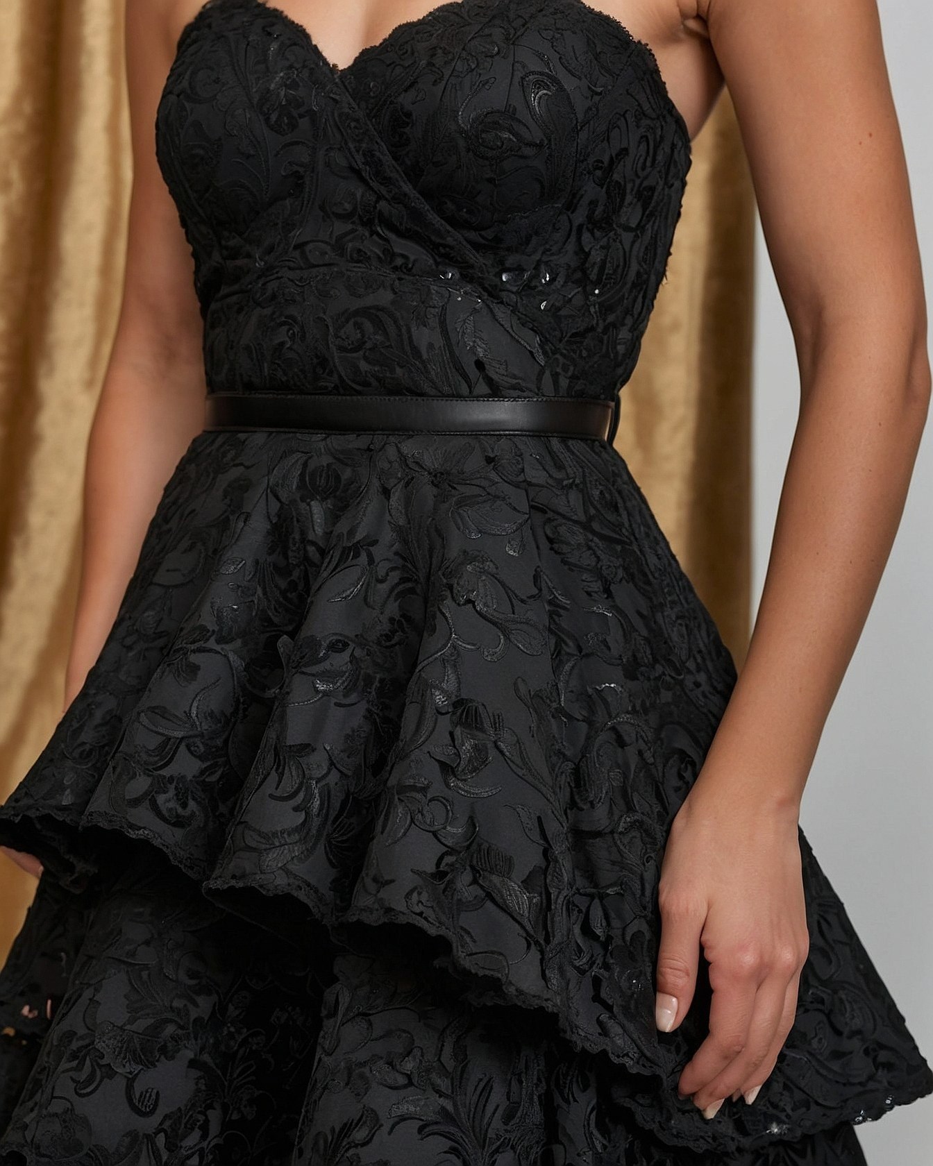 Making a Statement in a Tiered Black Prom Dress