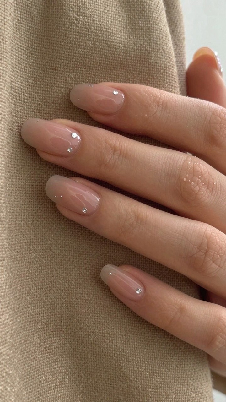 Adding Delicate Rhinestone Accents to Milky Nails