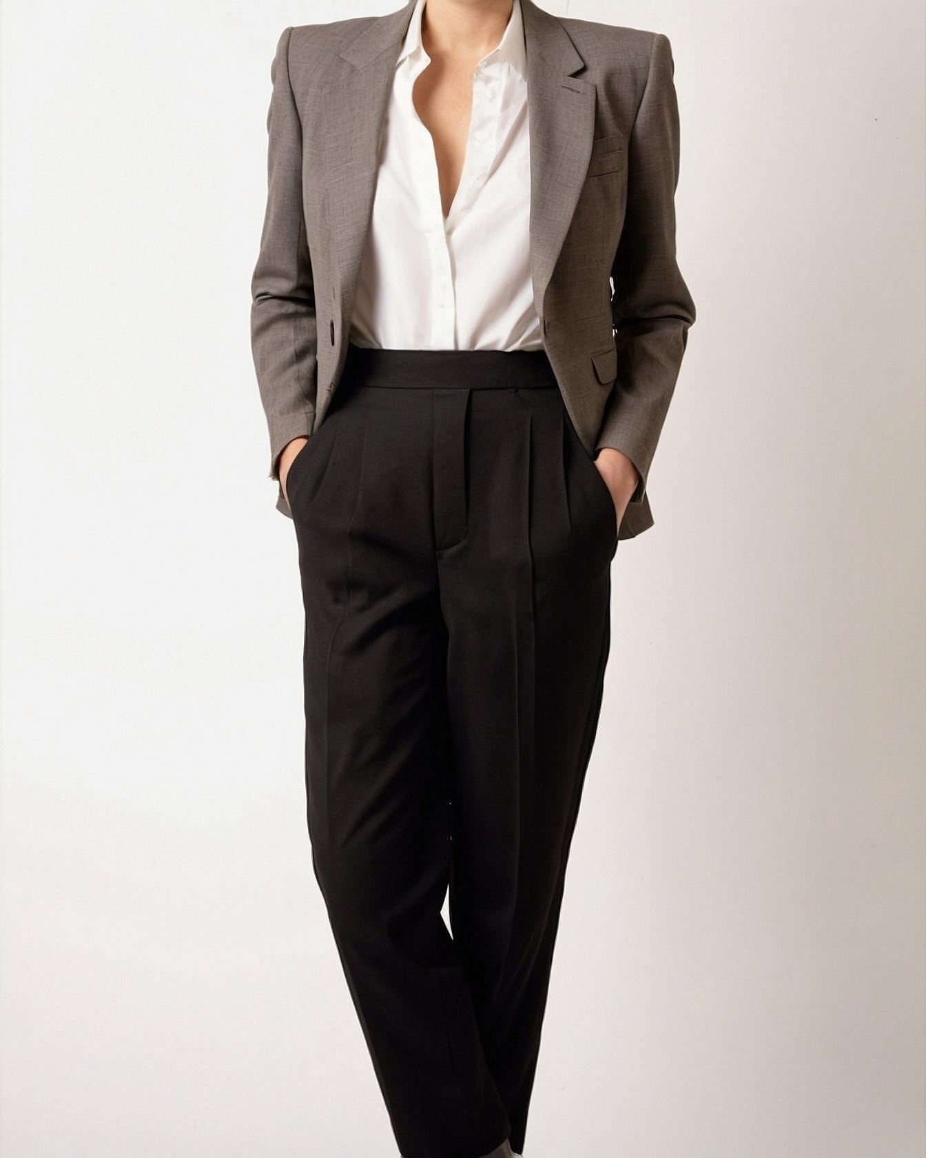 Taupe blazer and black pleats anchored by a crisp white shirt