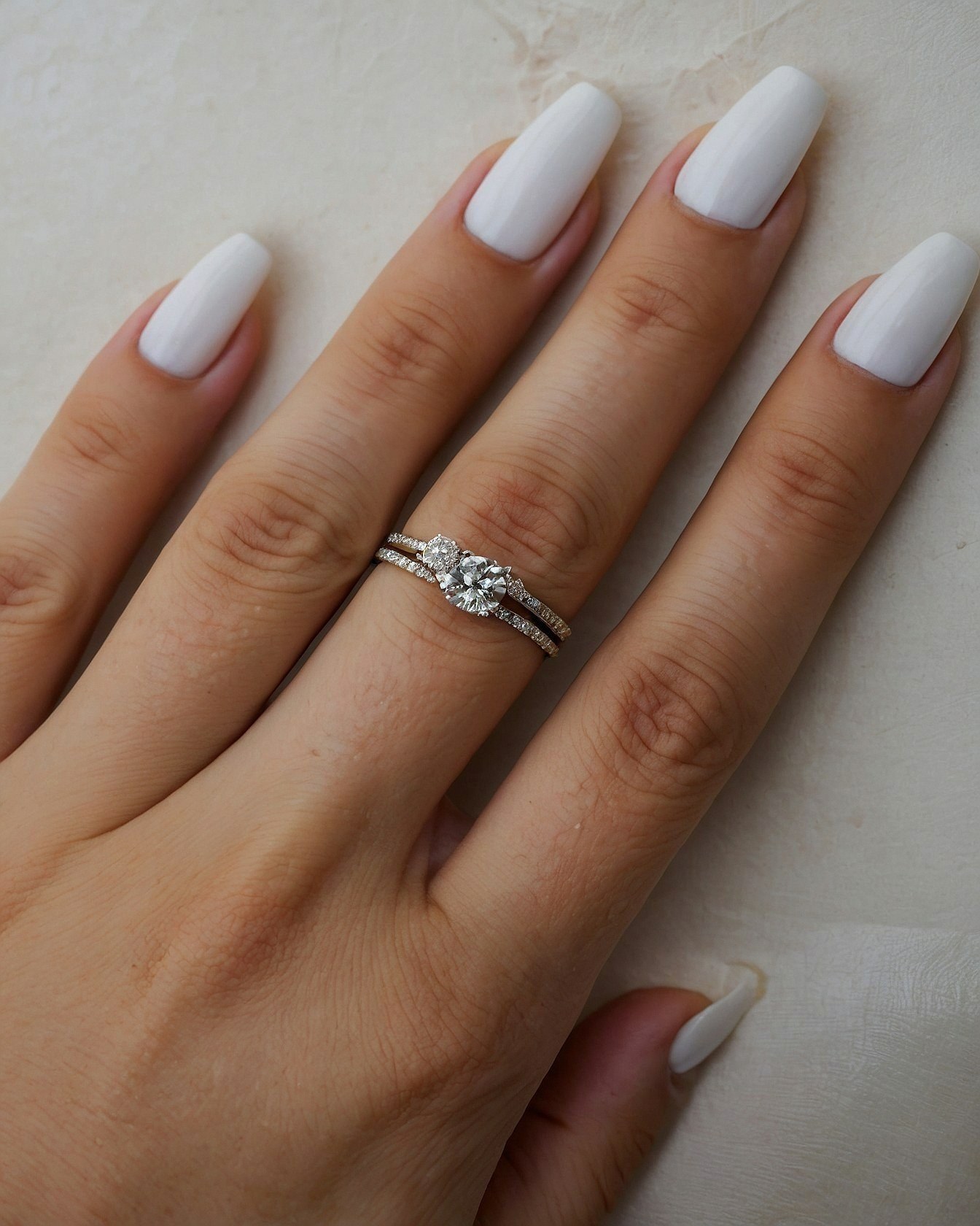 Crisp white coffin nails with diamond bands
