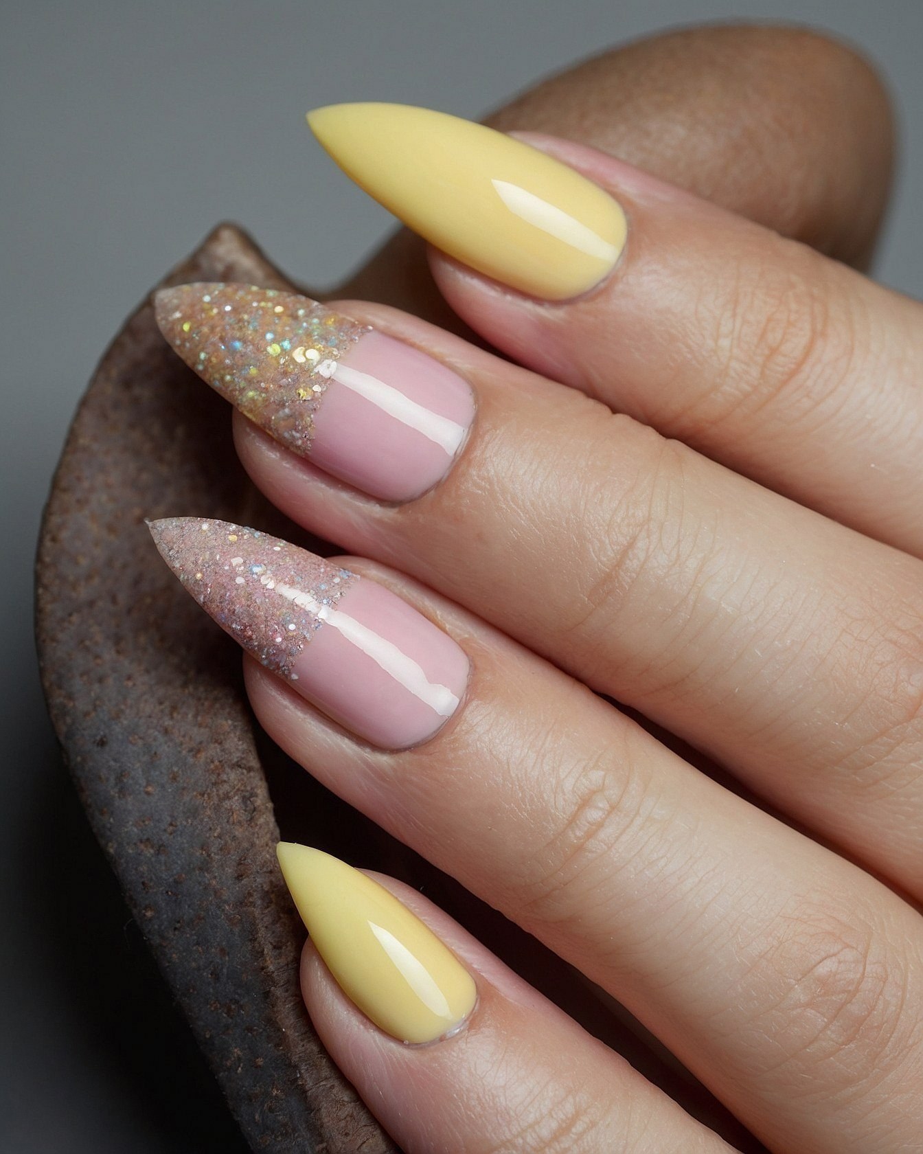Soft Yellow and Glitter French Fade Almond Nails
