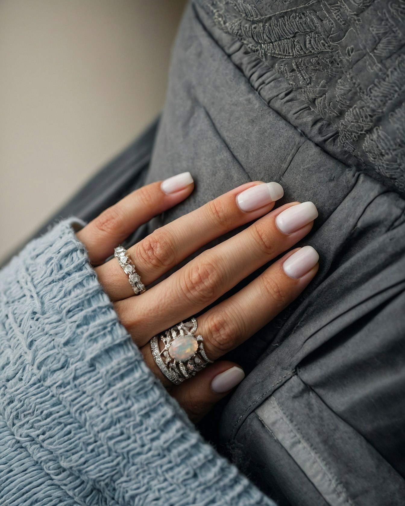 Ring Stack Highlights Delicate White Almond Nails