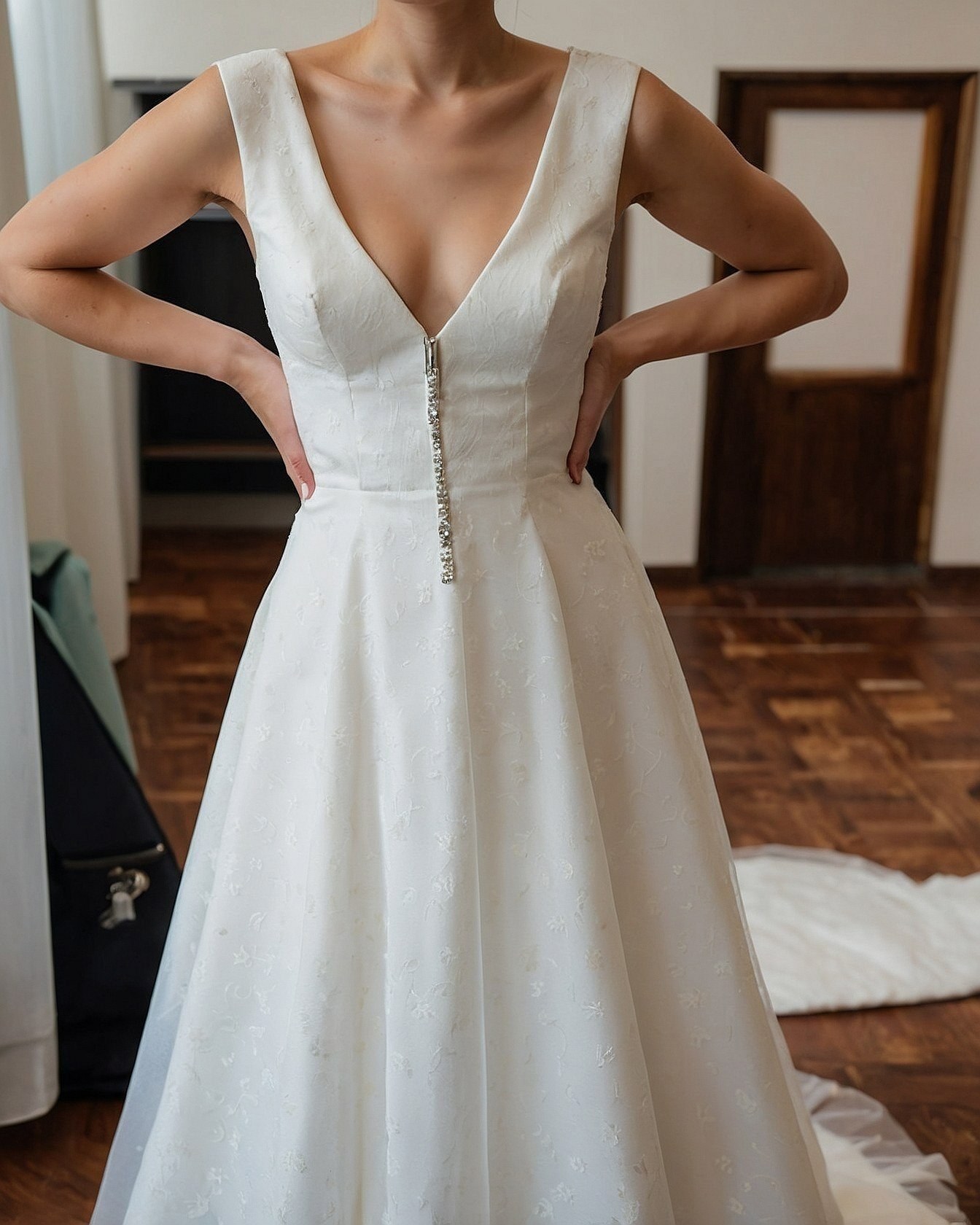 Sparkling Button Detail on a Deep V-Neckline