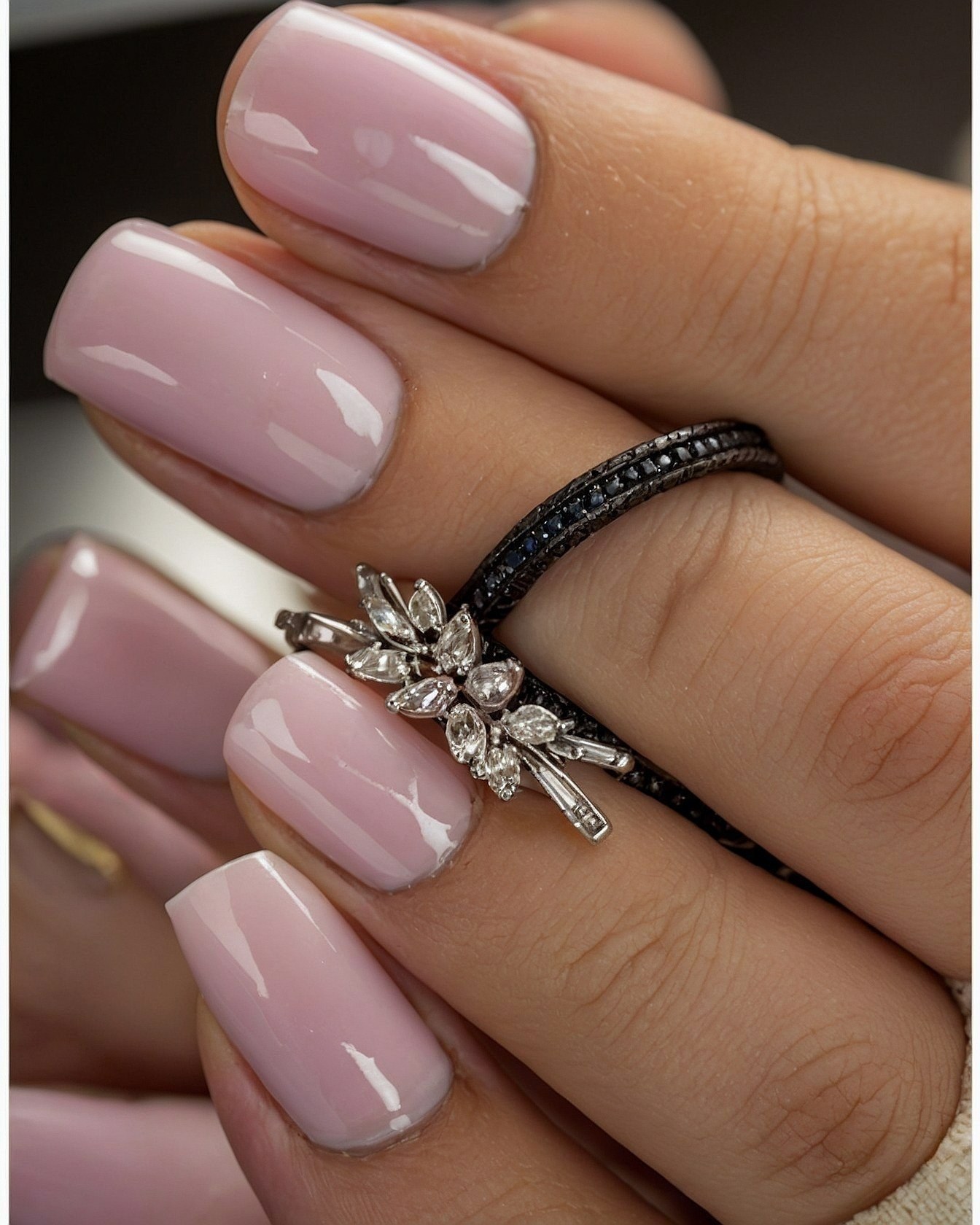 Close Up On Stacked Rings and Pastel Polish