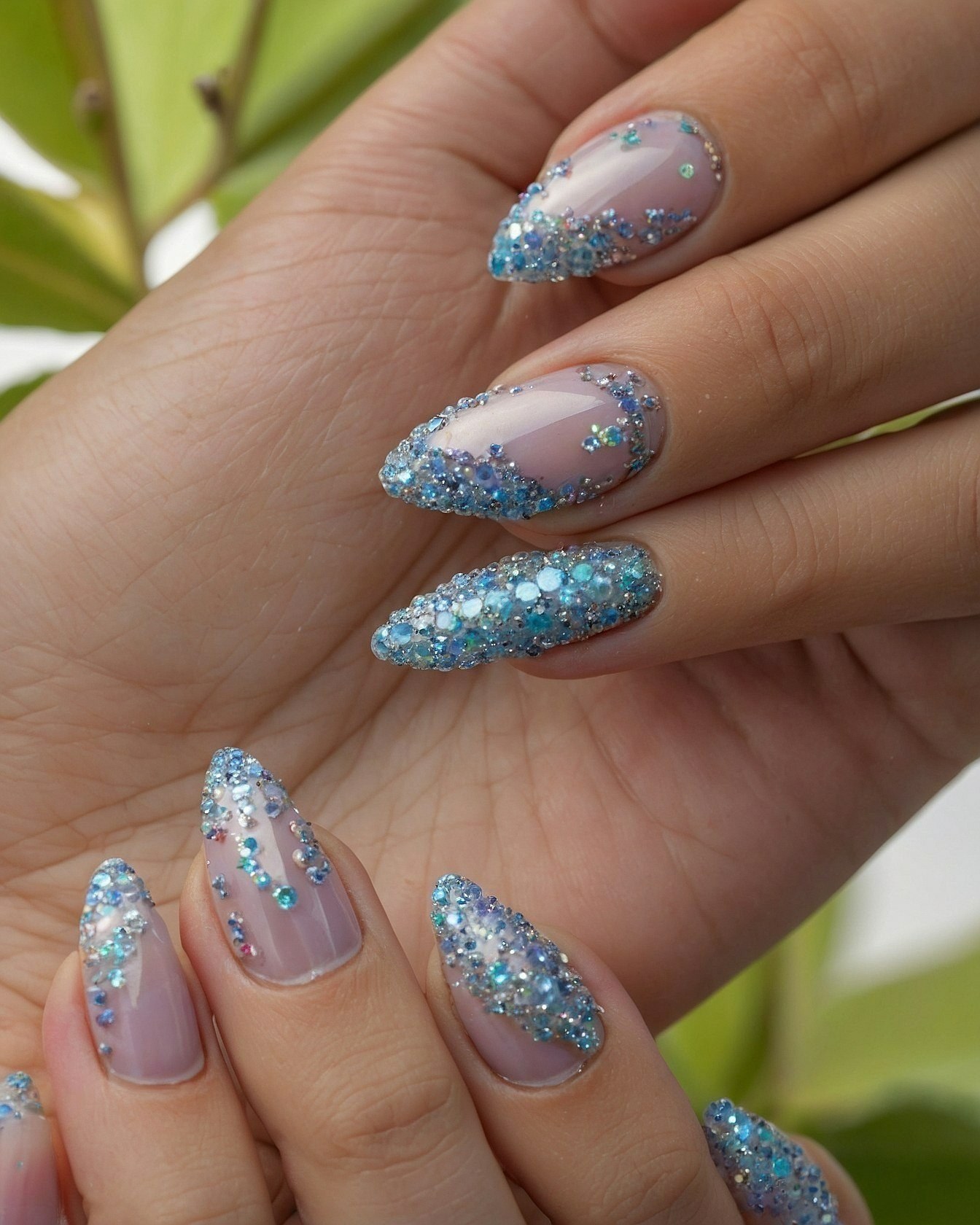 Close-Up of Sparkly Blue Almond Nails
