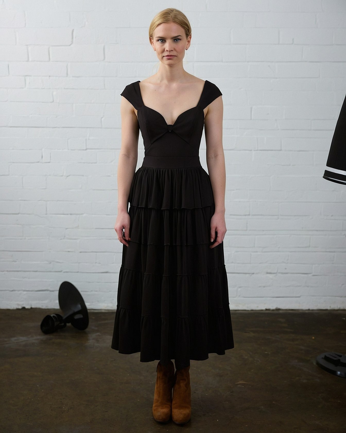 A sweetheart neckline with a delicate knot detail