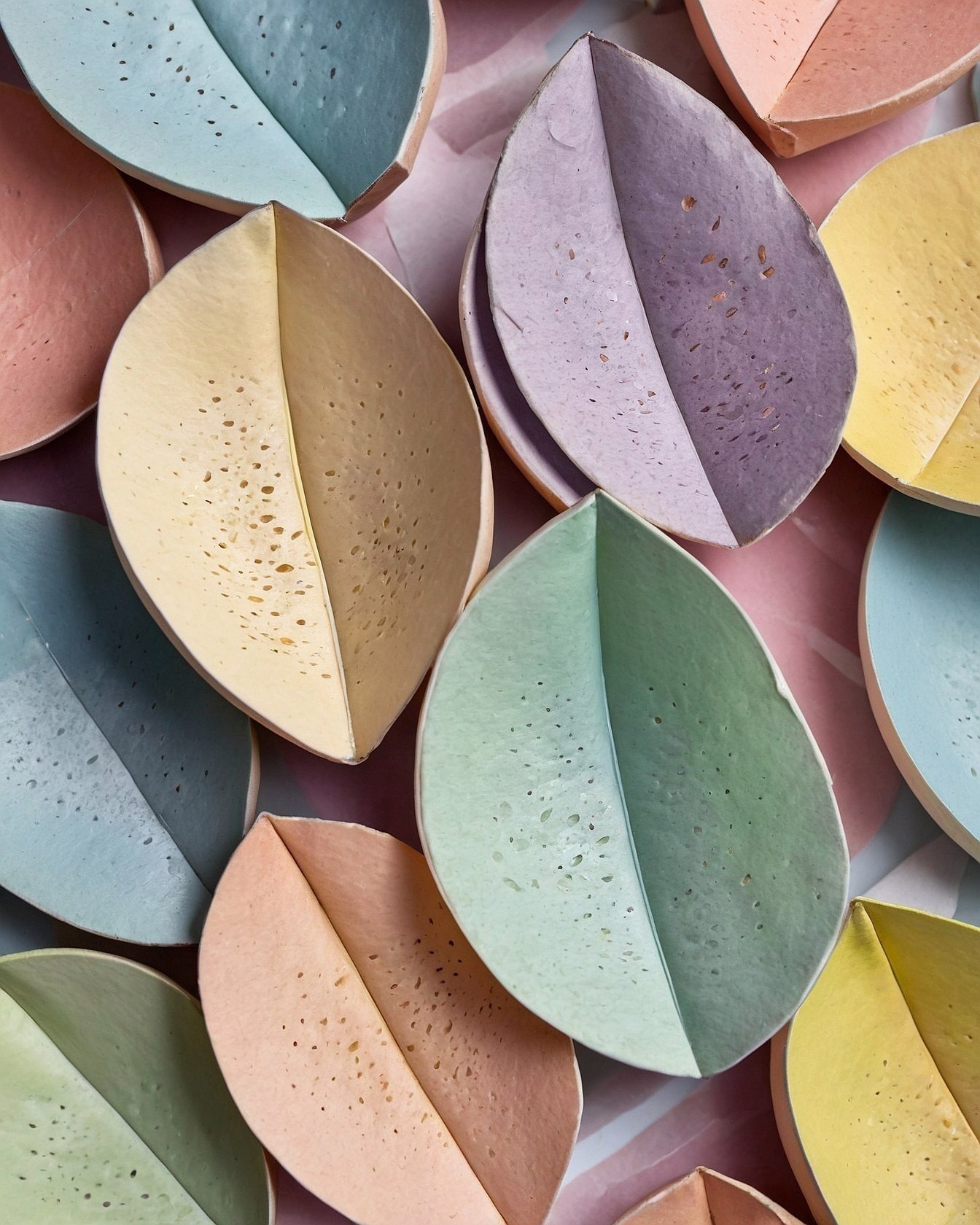 Delicate leaf shapes in subtle pastel tones