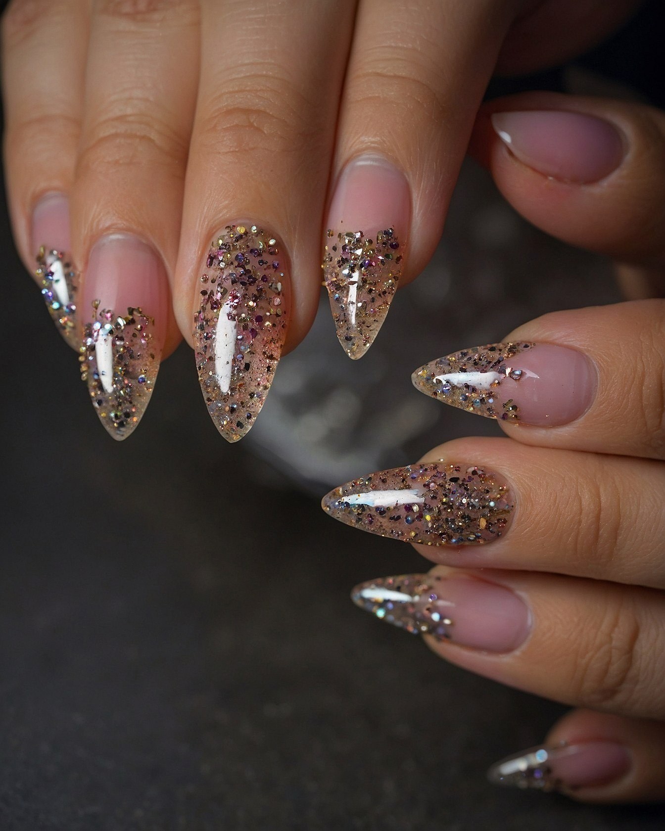 A Close-Up of Glitter-Adorned Almond Nails