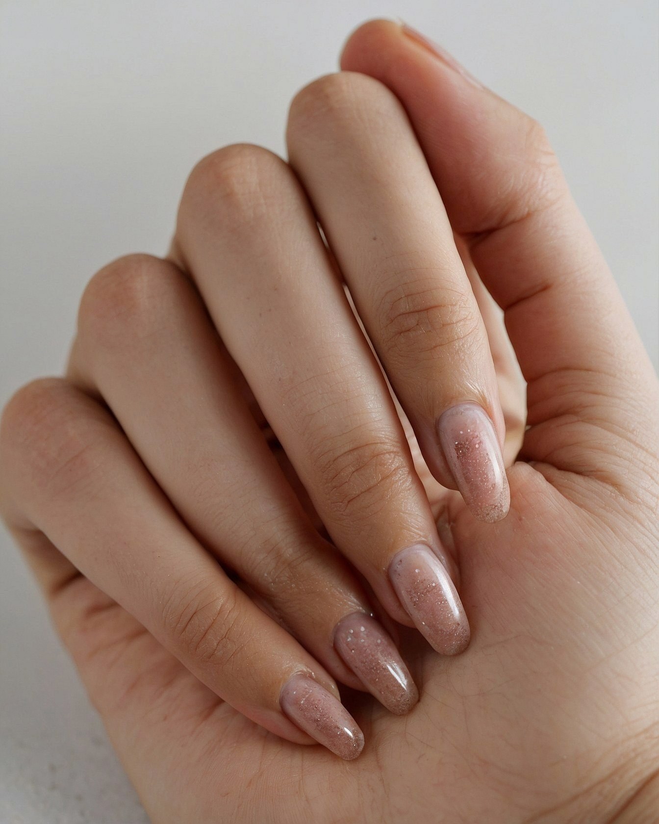 Subtle Glitter Tips with a Warm Hue