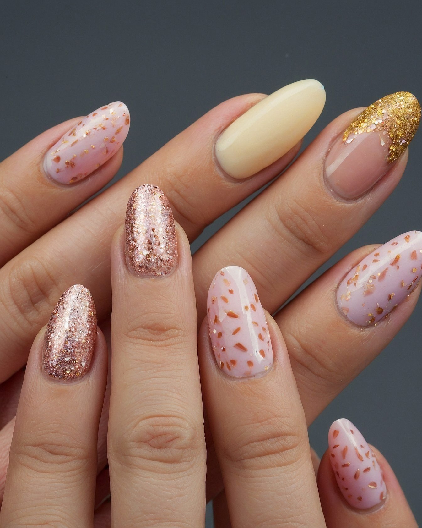 Almond nails with rose gold and champagne glitter