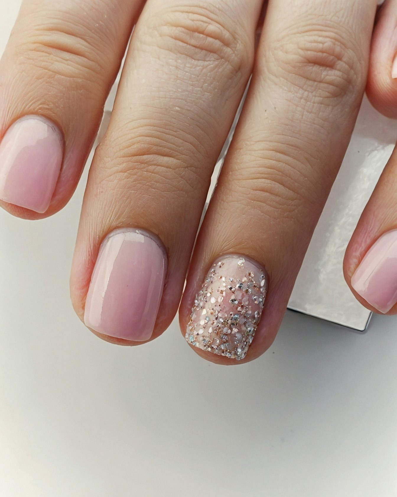 Close-up of Pale Pink and Glitter Square Nails