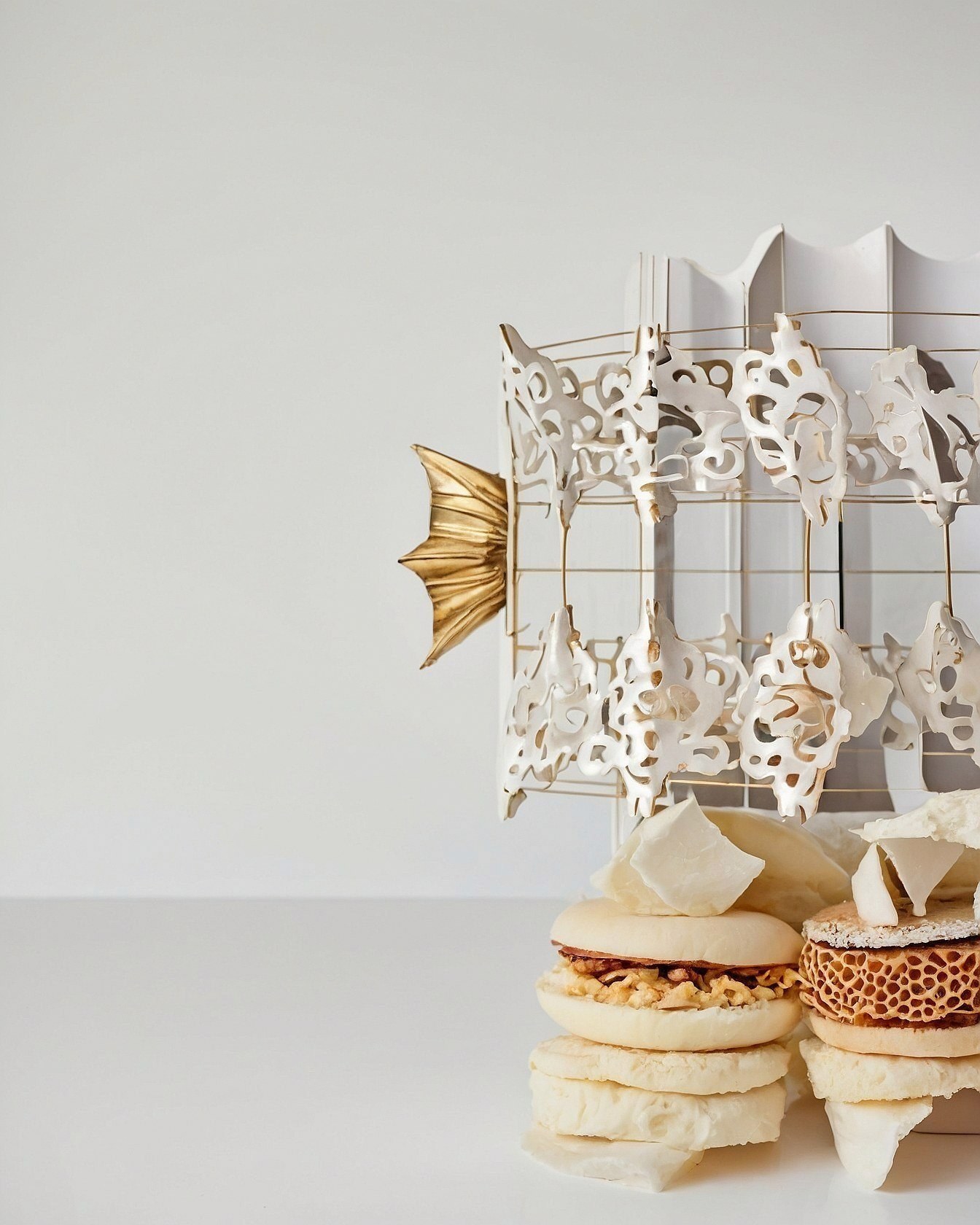 Metallic Gold Fish and White Sculptures