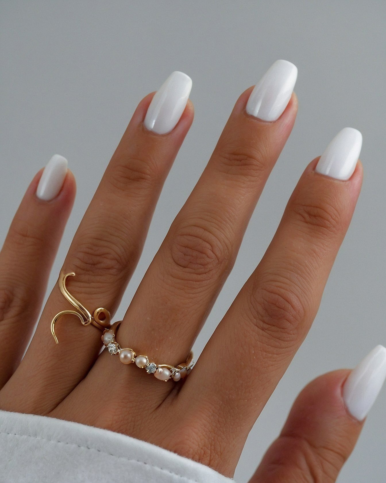 Pure White Oval Nails with Delicate Gold Jewelry