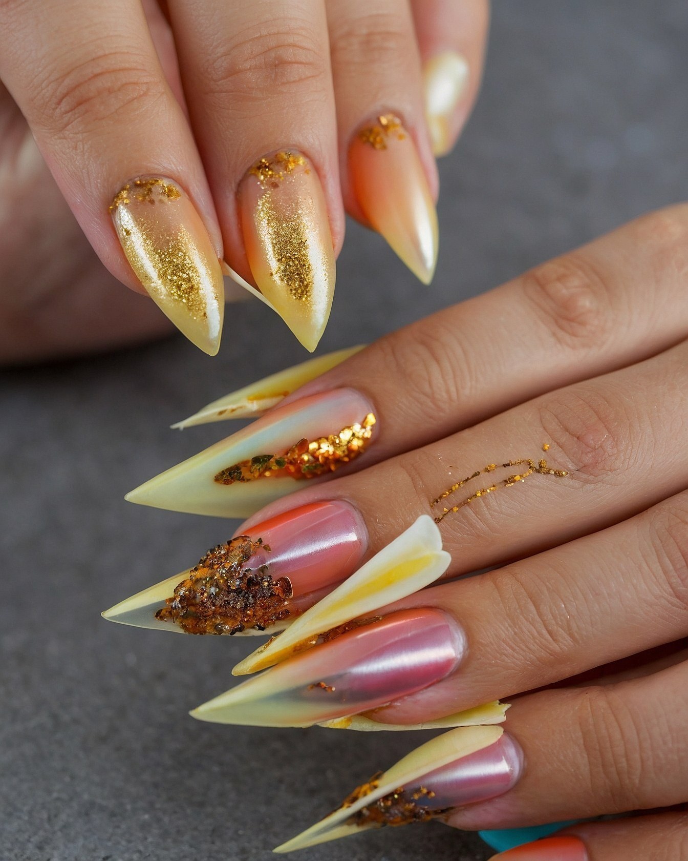 Sunset Hues and Golden Sparkle Across Stiletto Nails