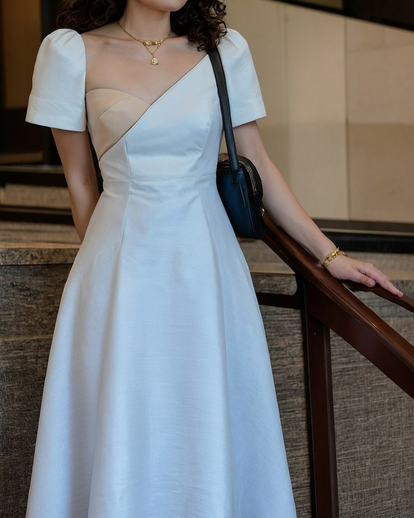 A Dress With An Asymmetrical Neckline In Ethereal Tones