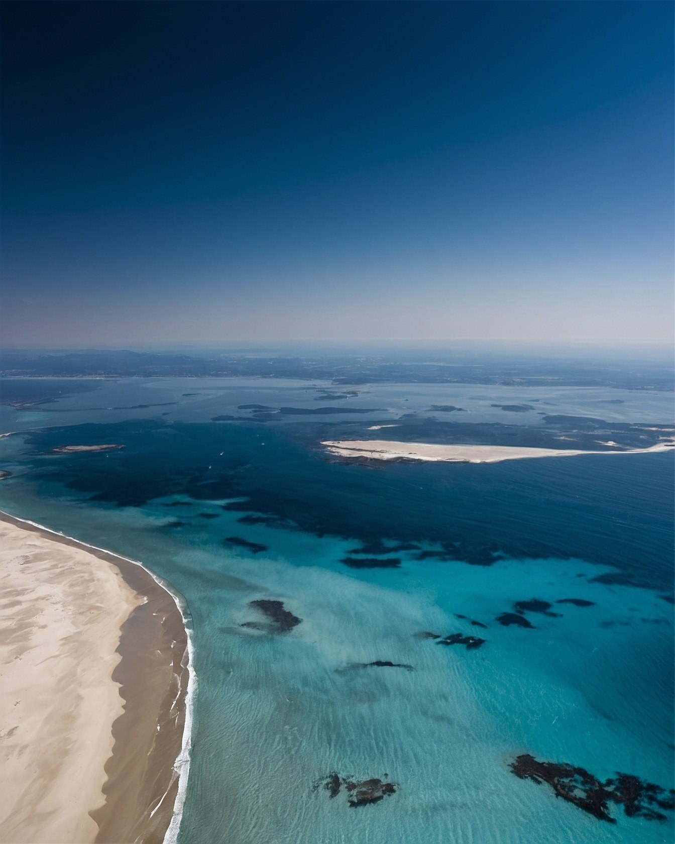 Turquoise Waters and Sandy Shoreline from Above
