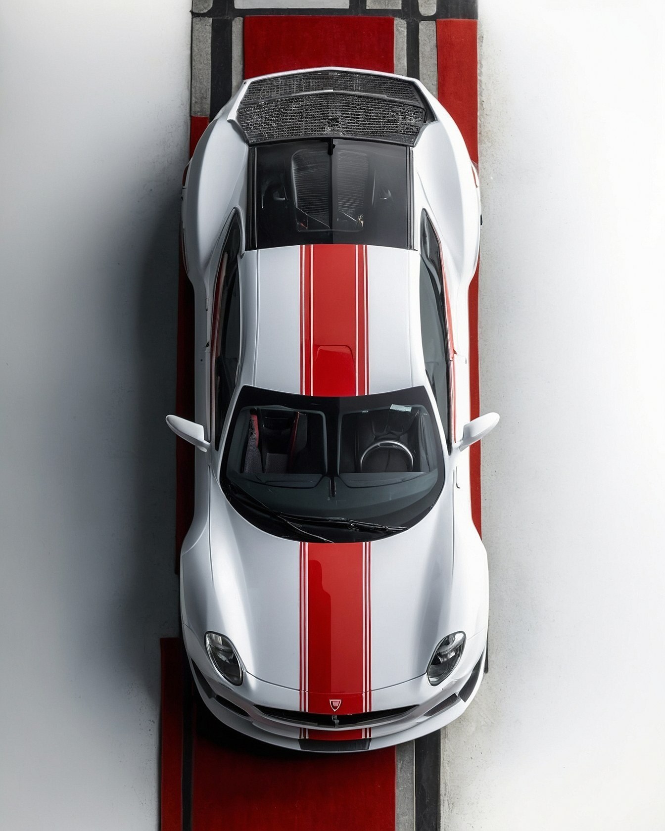 Top-Down View of a Striking Red and White Sports Car